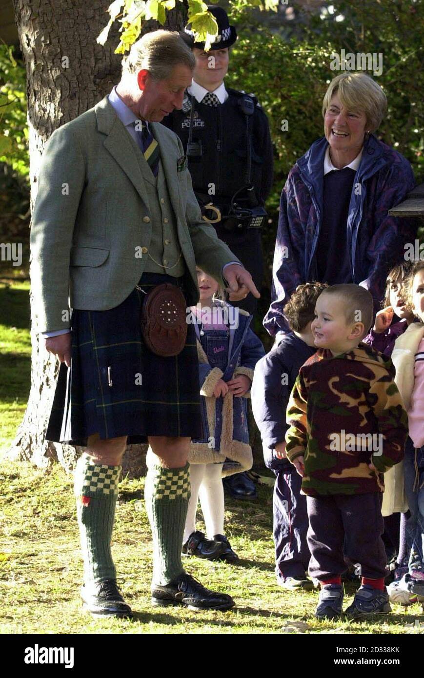 His Royal Highness the Prince Of Wales, Duke of Rothesay Deputy Colonel in Chief to the Highlanders (Royal Highland Regiment) at the Gordon Highlanders Museum in Aberdeen where he views a parade during a ceremony to lay up the Regiment's last Colours. He is pictured meeting children from the TreeHouse Nursery who were there to meet him on his departure. Stock Photo