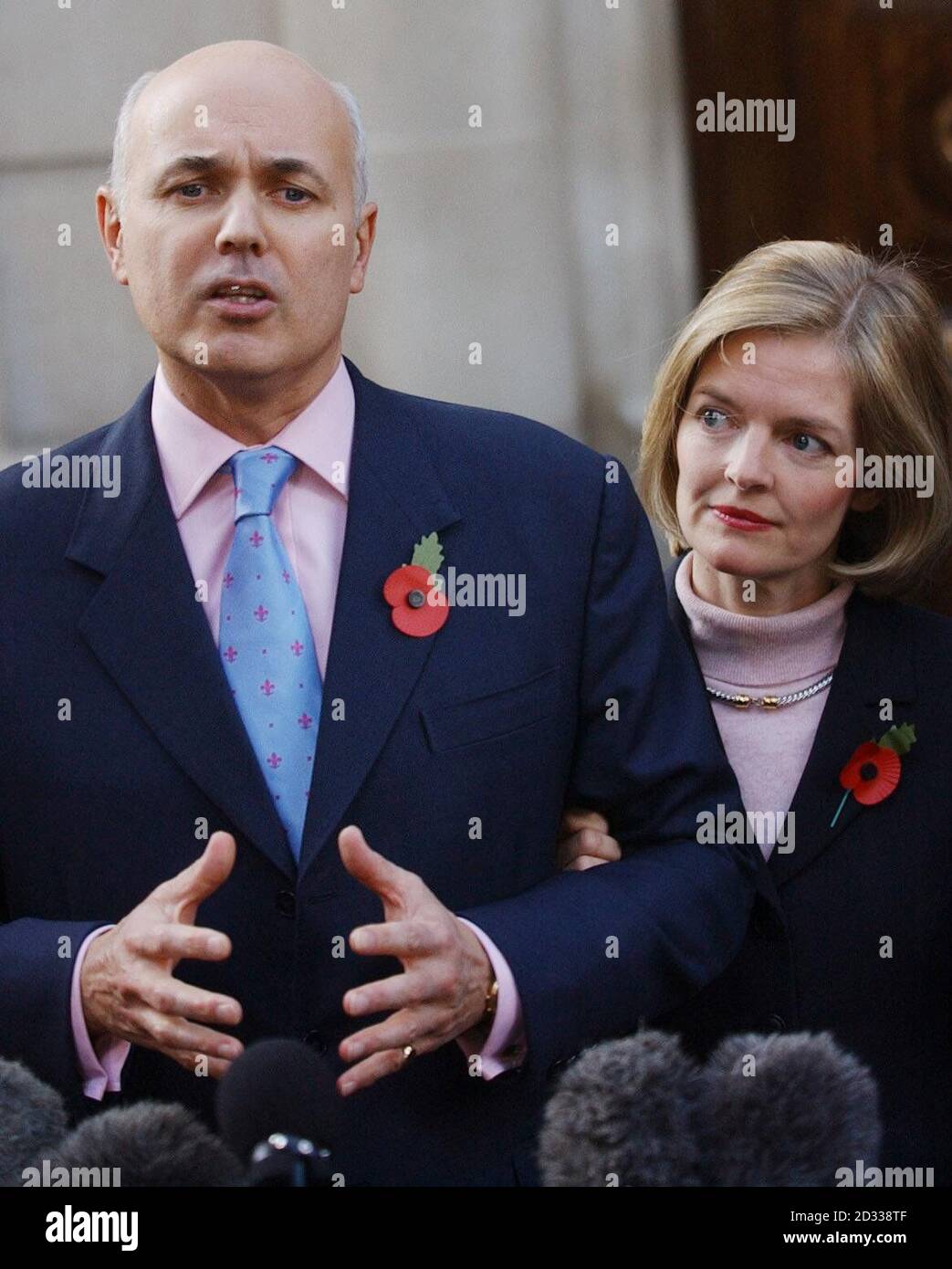 Iain Duncan Smith talks to journalists, with his wife, Betsy, at his side, outside the Conservative Central Office in London after 25 MPs wrote to Sir Michael Spicer, chair of the 1922 Committee of backbenchers, demanding a vote of confidence in him as leader.  Mr Duncan Smith told journalists he welcomed the opportunity to win a 'renewed mandate' to lead the party to the next election.   Stock Photo