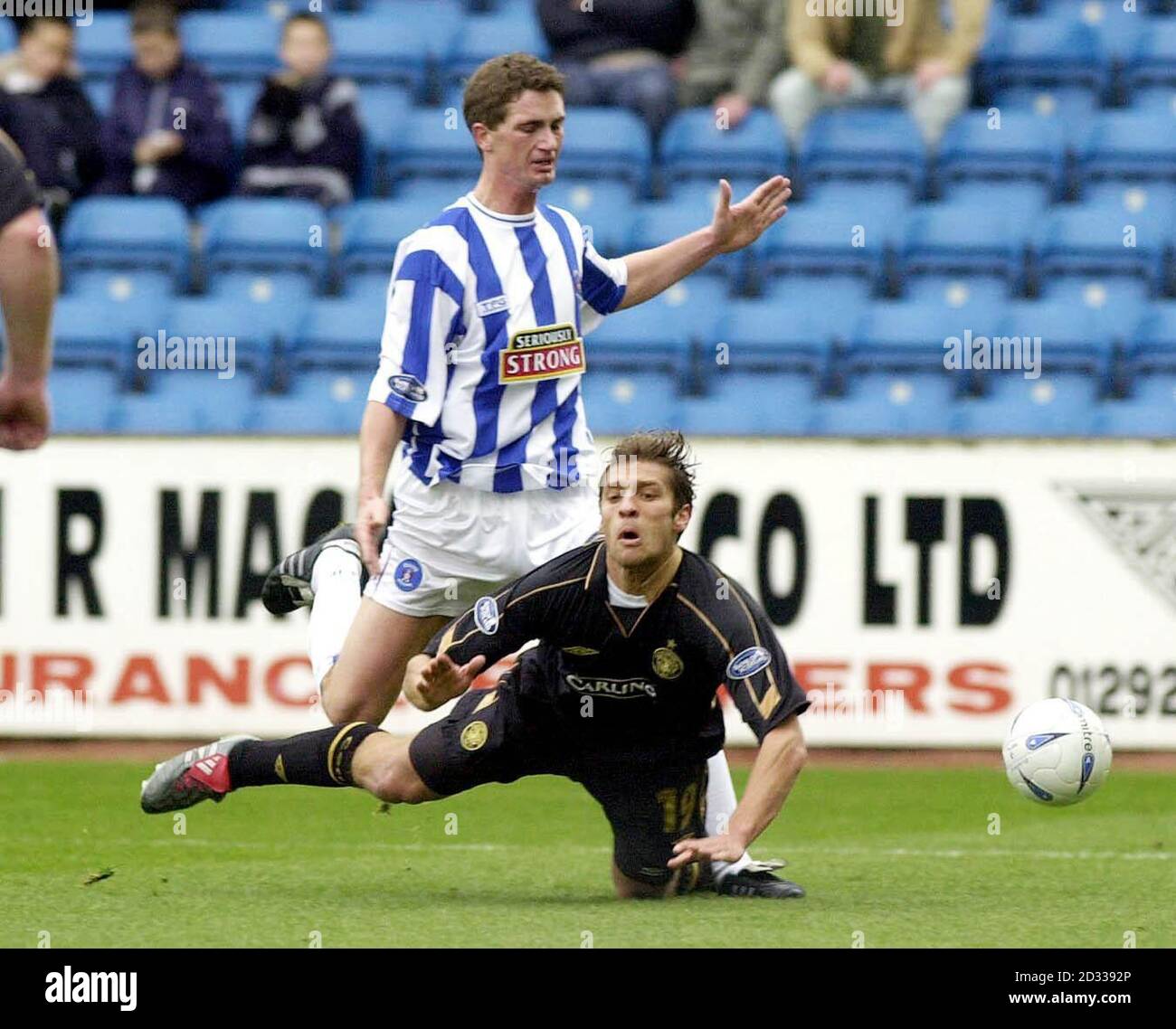 Celtic's Stilian Petrov earns a penalty after being tackled by Kilmarnock's Gary Mcdonald (top) during their Bank of Scotland Scottish Premiership match at Kilmarnock's Rugby Park ground. Stock Photo