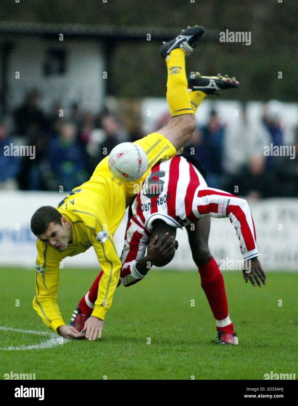 Tranmere's Graham Allen (left) tumbles over Vincent John of Hornchurch, during the FA Cup second round match at the Hornchurch Stadium,  Upminster.    THIS PICTURE CAN ONLY BE USED WITHIN THE CONTEXT OF AN EDITORIAL FEATURE. NO UNOFFICIAL CLUB WEBSITE USE. Stock Photo