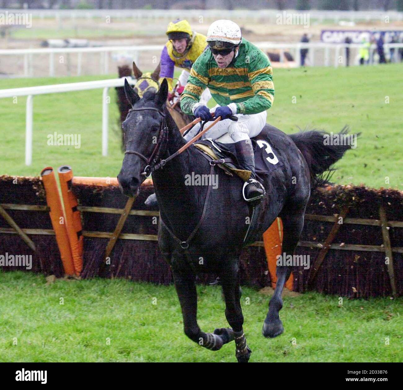 Krach ridden by Thierry Doumen, takes the last hurdle and goes on to win The John Lewis Memorial Novices' Hurdle Race, at Ascot.  Stock Photo