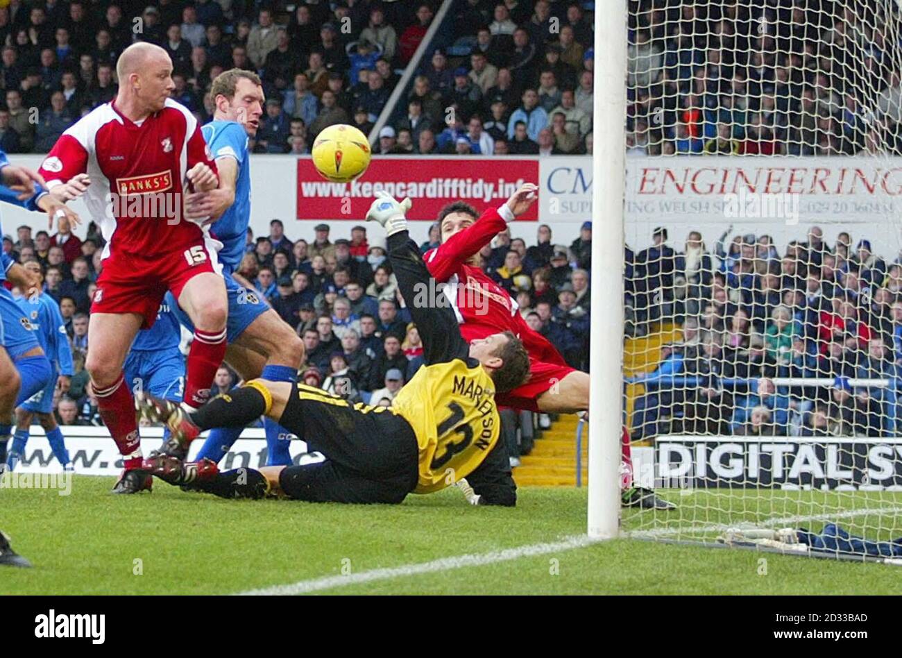 Walsall's Neil Emblen (left) scores past Cardiff City goalkeeper Martyn Margetson during the Nationwide Division One Boxing day match held at The Millennium Stadium, Cardiff.    THIS PICTURE CAN ONLY BE USED WITHIN THE CONTEXT OF AN EDITORIAL FEATURE. NO UNOFFICIAL CLUB WEBSITE USE. Stock Photo