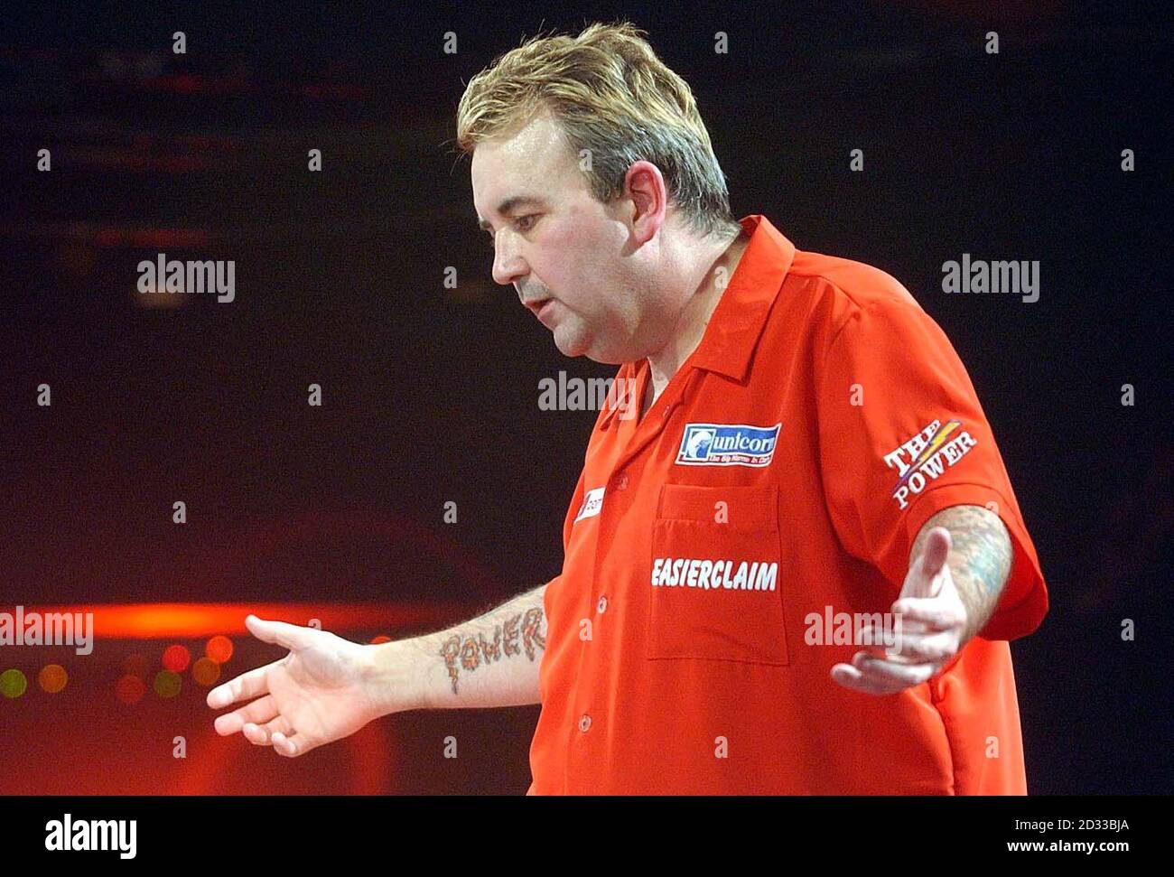 Phil Taylor in action against Kevin Painter at the Circus Tavern in Purfleet, Essex, during the final of the World Darts Championship. Stock Photo