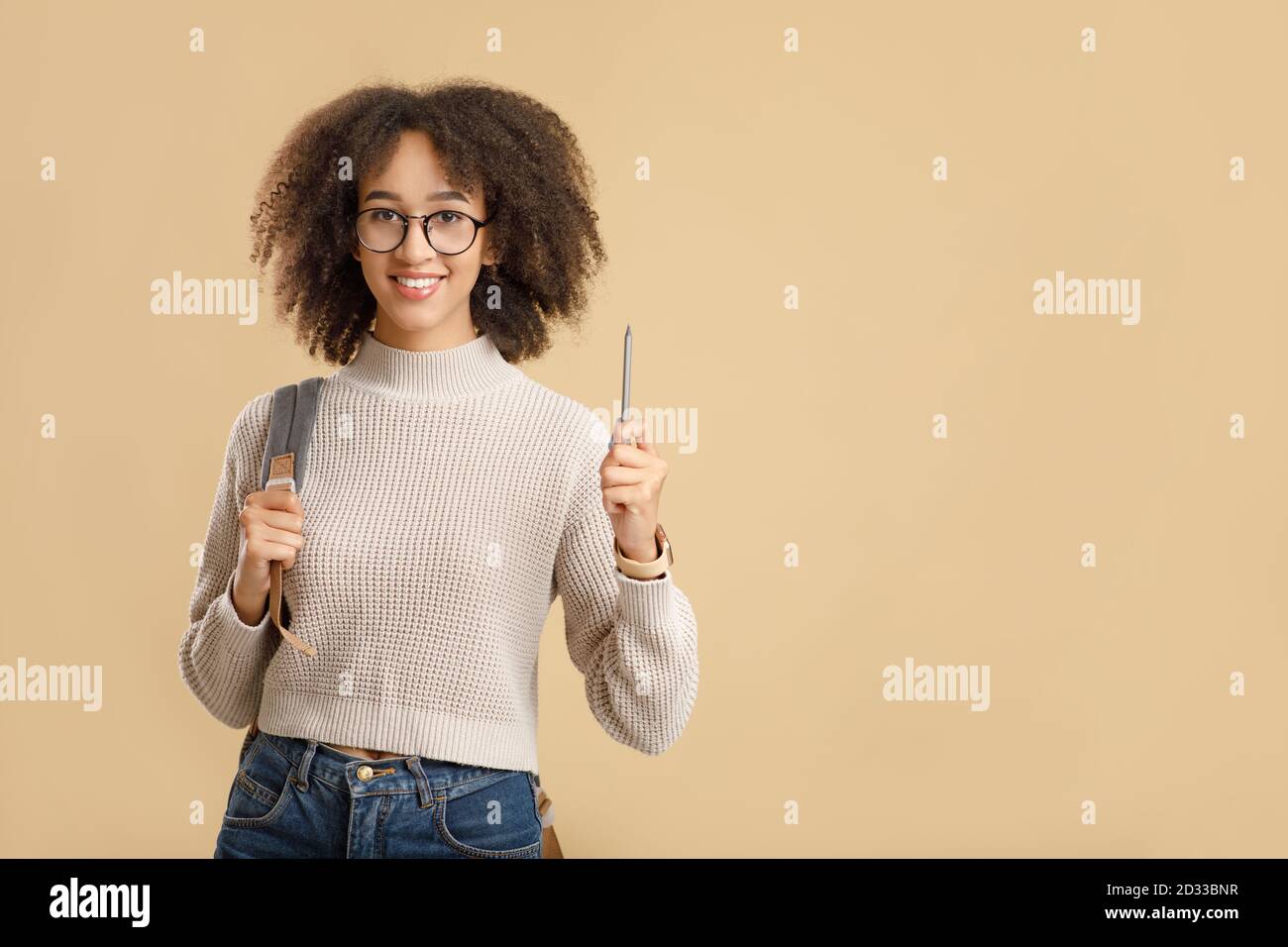 Got an idea, knowledge and education concept. Cute african american woman hipster with glasses and backpack raises pencil up Stock Photo