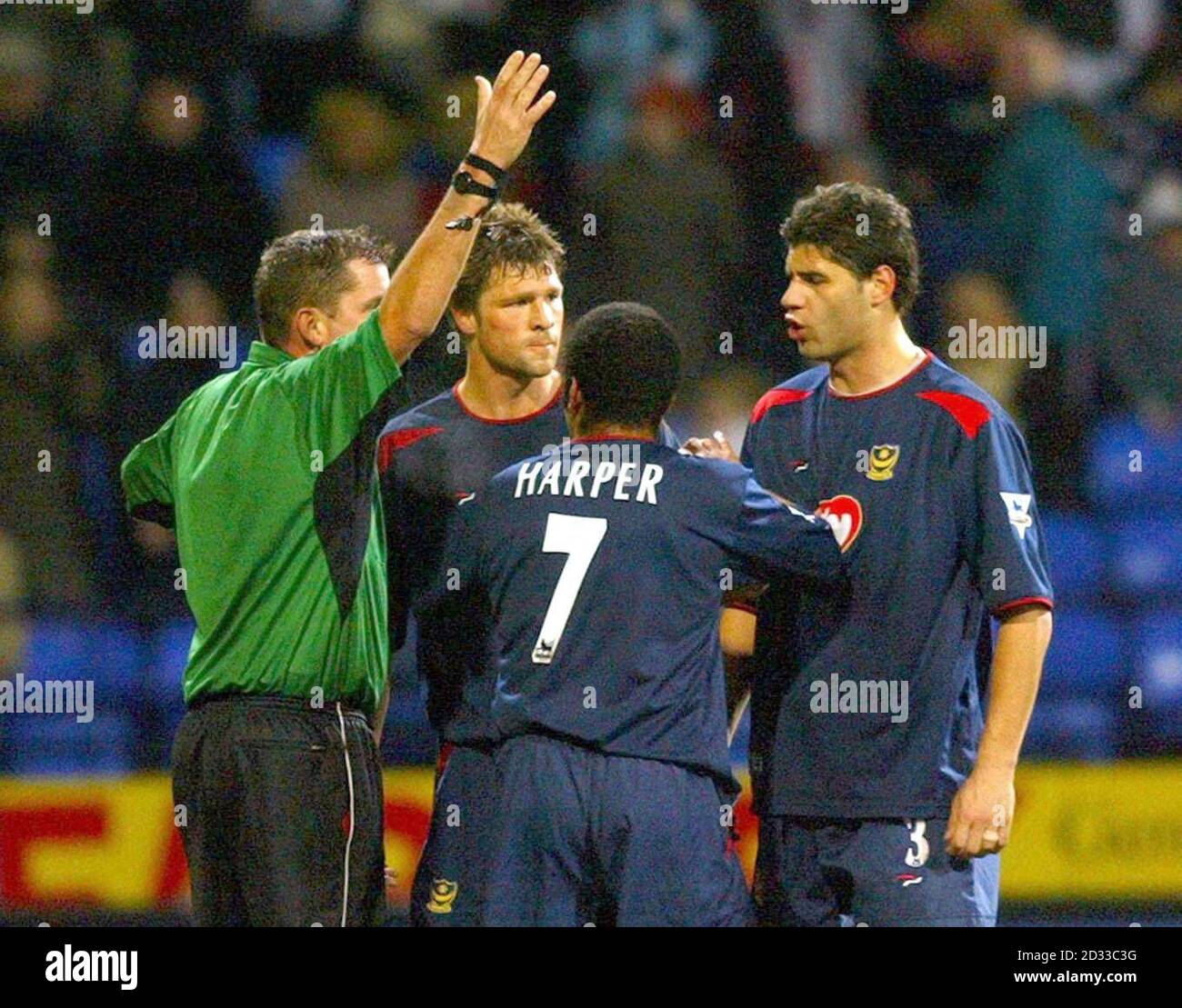 Portsmouth's Dejan Stefanovic (right) is sent off my referee Phil Dowd, during their FA Barclaycard Premiership match at Bolton's Reebok Stadium. (Final score 1-0) Stock Photo