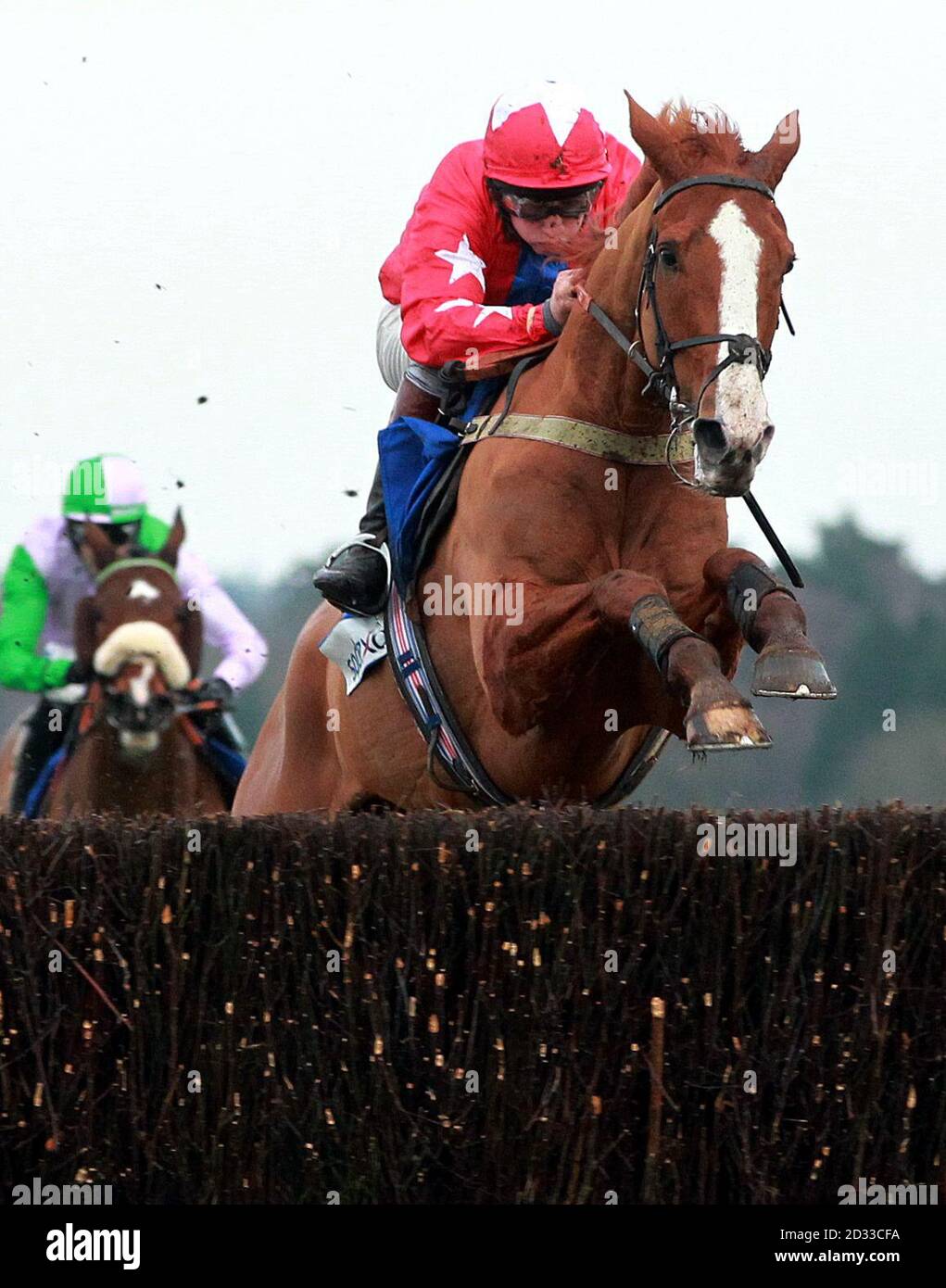 Sire De Grugy ridden by Jamie Moore wins the Sodexo Clarence house steeple chase during Clarence House Chase Raceday at Ascot Racecoure, Ascot. Stock Photo