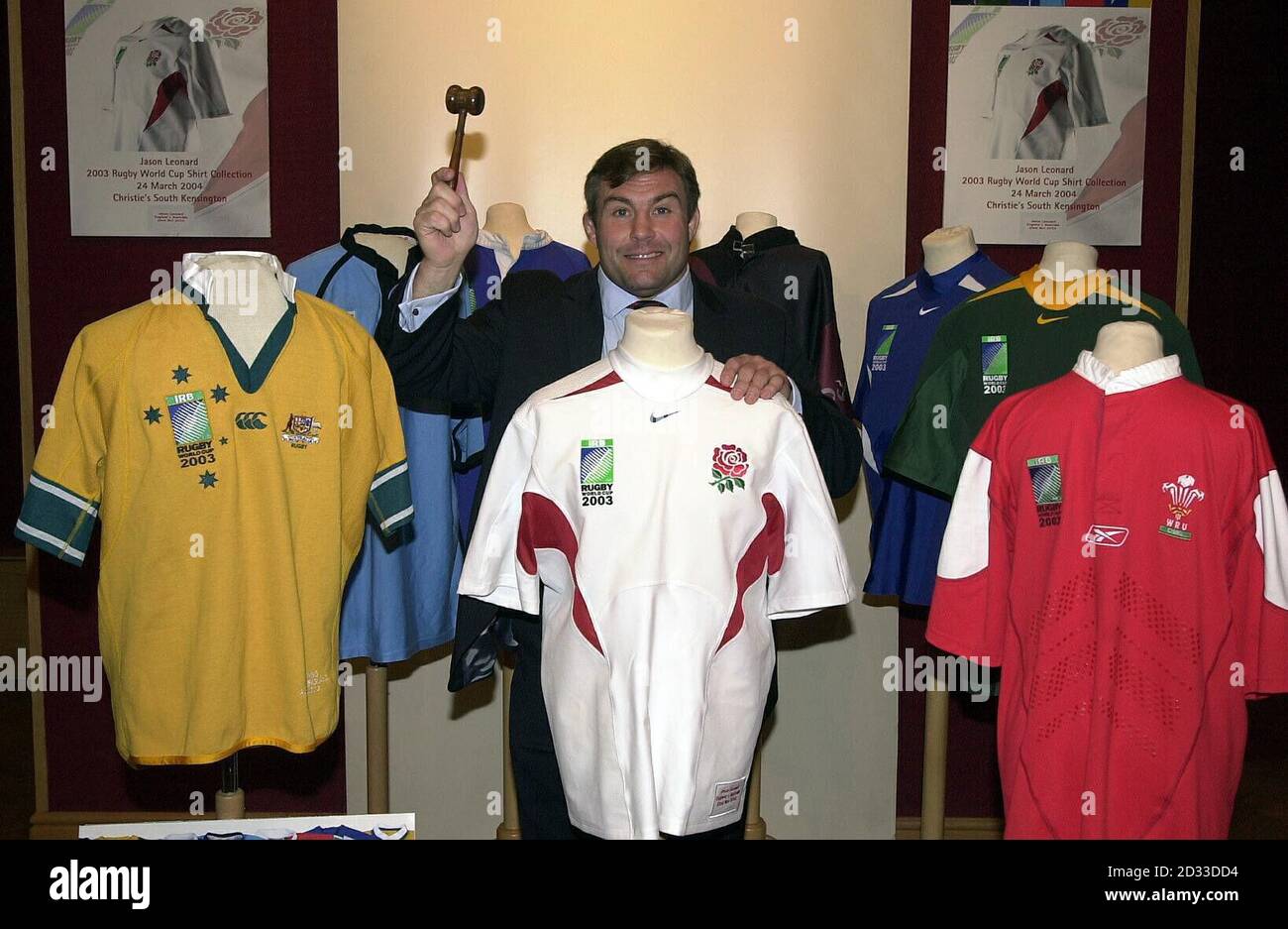 International rugby player, Jason Leonard reveals his 2003 Rugby World Cup shirt collection to be auctioned at Christie's, London. Jason is leaning on his England 2003 Rugby World Cup final short-sleeved shirt, part of eight in the collection. Stock Photo