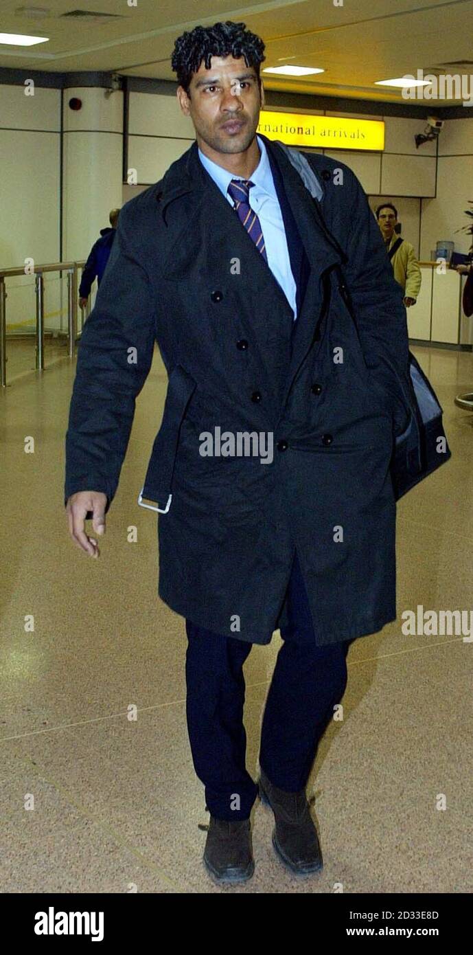 Barcelona's manager Frank Rijkaard arriving at Glasgow International ariport, before the game against Celtic in the fourth-round first leg Uefa Cup tie at Parkhead football ground on March 11 2004, Glasgow.  EDITORIAL USE ONLY  Stock Photo