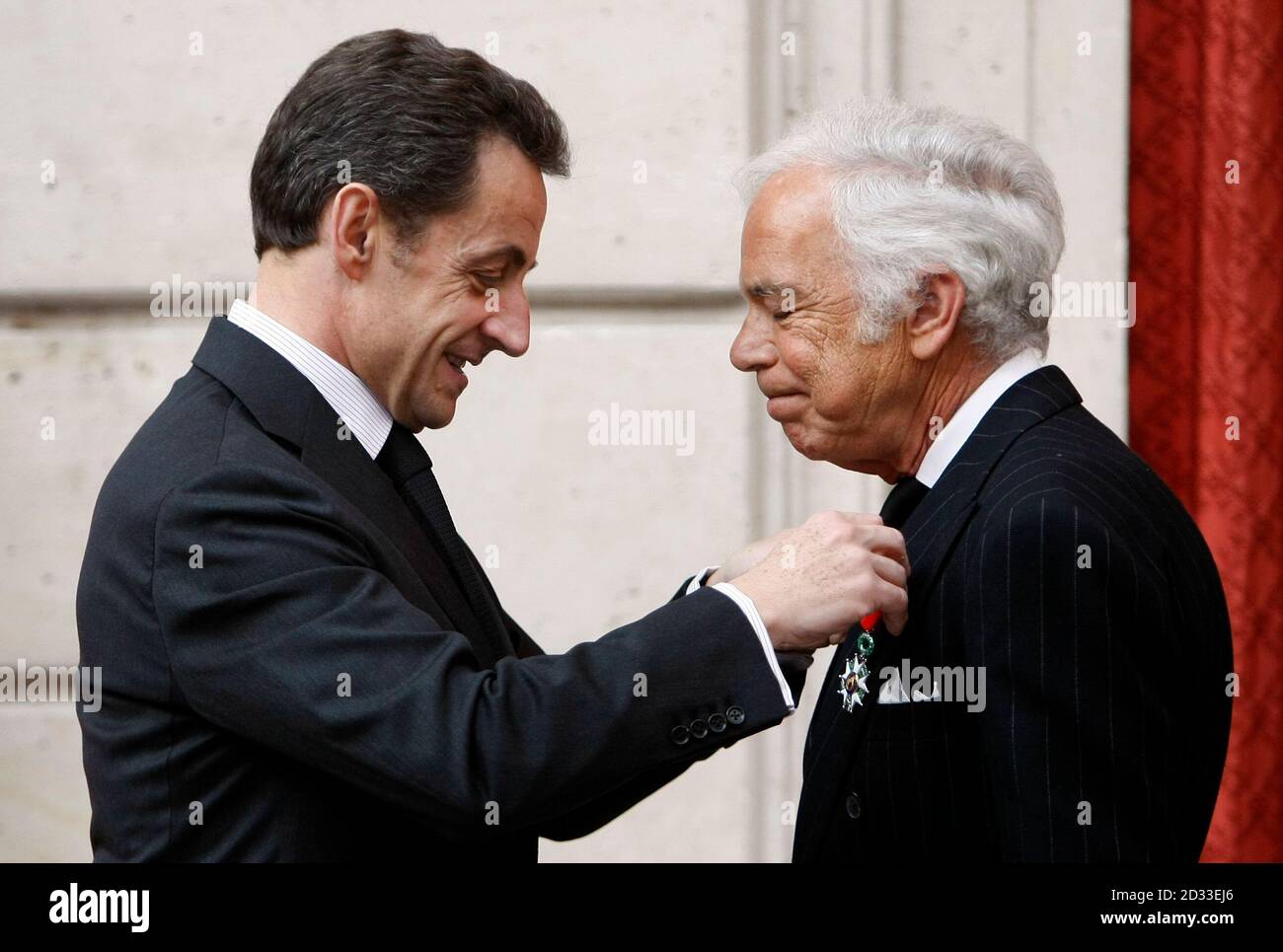 . fashion designer Ralph Lauren (R) receives the Chevalier of the Legion  of Honour from France's President Nicolas Sarkozy during a ceremony at the  Elysee Palace in Paris, April 15, 2010. REUTERS/Francois
