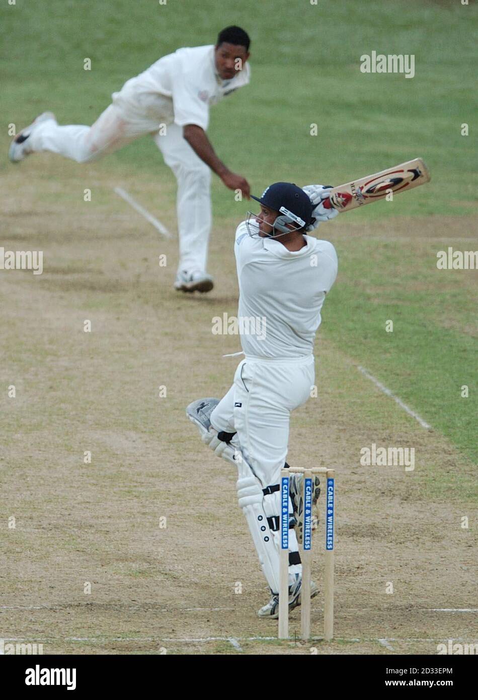 England batsman Mark Butcher hooks the ball for 4 runs off the bowling of West Indian Adam Sanford, during the second day of the second Test match at Port of Spain, Trinidad. Stock Photo