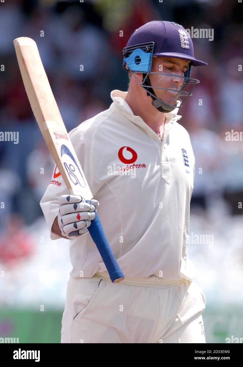 England batsman Graham Thorpe raises his bat as he walks off the pitch after being dismissed for 90 runs, during the fourth day of the second Test match against the West Indies at the Queen's Park Oval, Port of Spain, Trinidad. Stock Photo