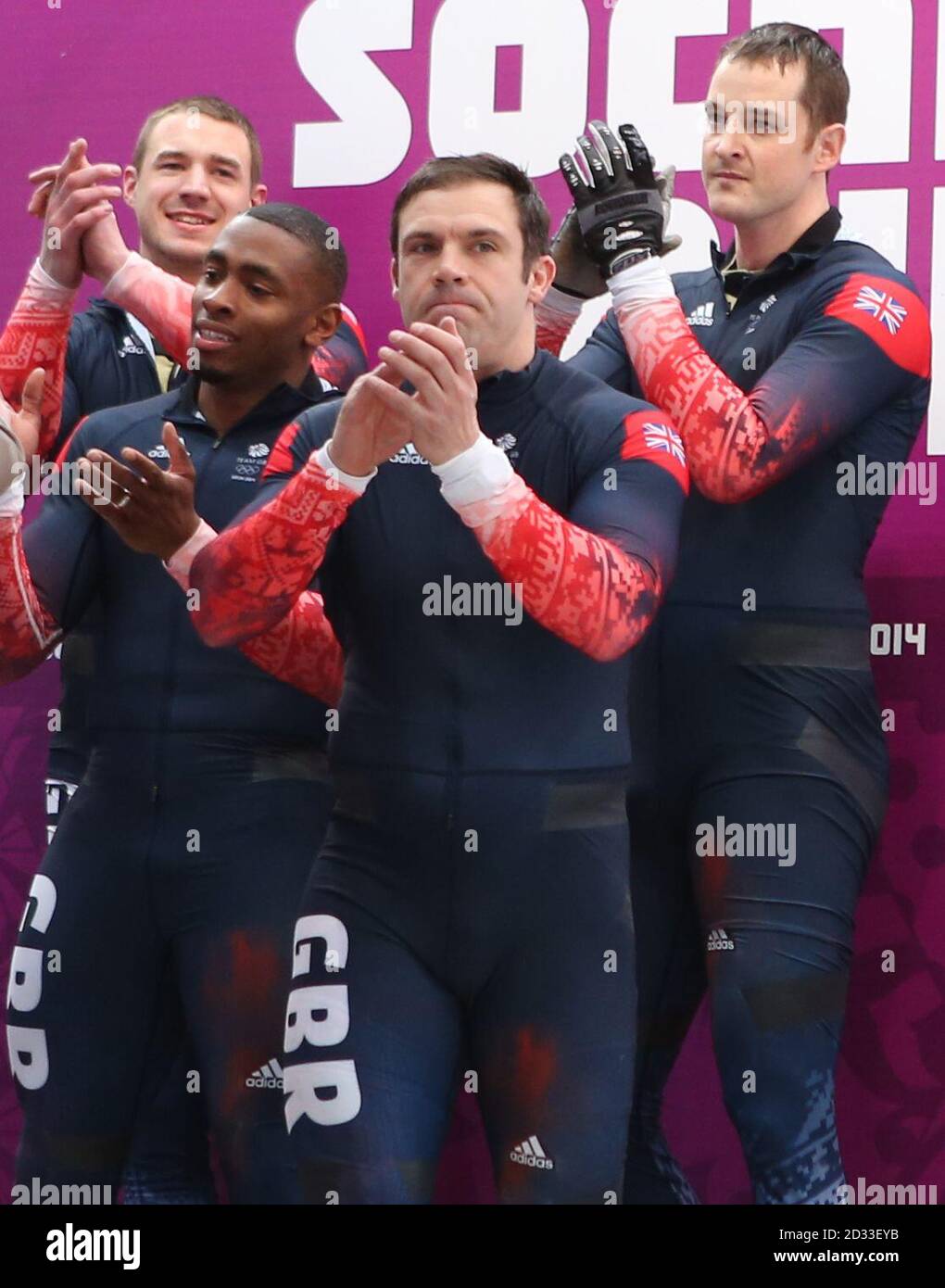 Great Britain Men's Bobsleigh GBR-1 Team of (left to right) Stuart Benson, Joel Fearon, John Jackson and Bruce Tasker after their fourth run of the men's 4 man Bobsleigh at the Sanki Sliding Centre during the 2014 Sochi Olympic Games in Krasnaya Polyana, Sochi. Russia. Stock Photo