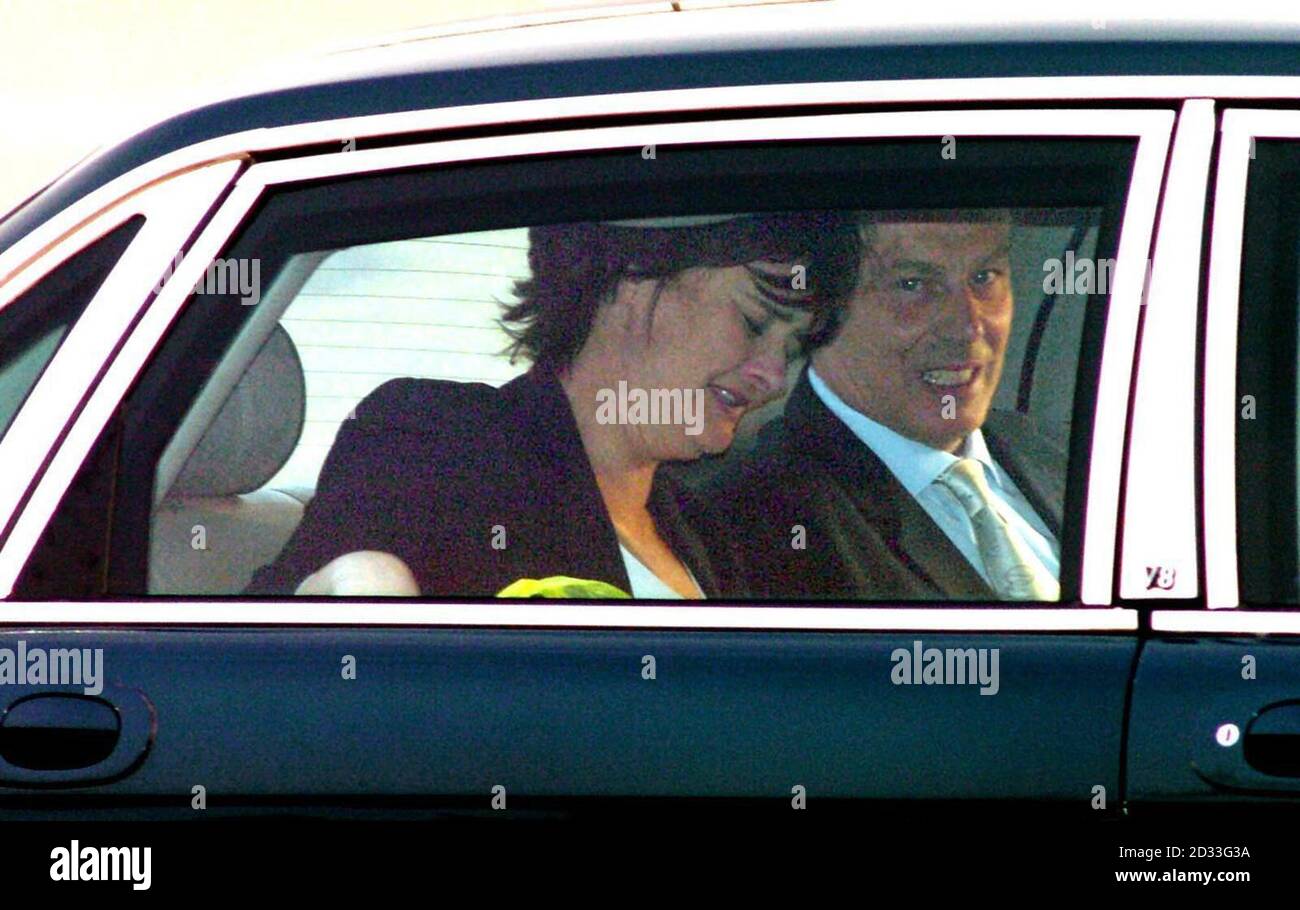 Prime Minister Tony Blair and his wife Cherie arrive at Heathrow Airport, after his meeting with President Bush in Washington. Mr Blair today said the battle lines are clear in Iraq and told critics 'there is only one side to be on'. He was speaking after crisis talks in Washington which ended with him and US President George Bush vowing to defeat insurgents. Stock Photo