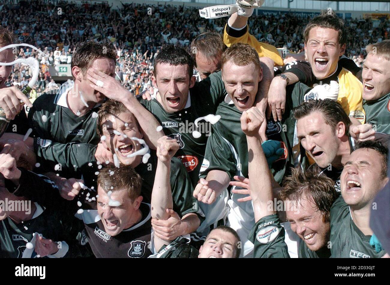 Plymouth Argyle players celebrate their victory and promotion after their Nationwide Division Two match against QPR at Home Park, Plymouth.    THIS PICTURE CAN ONLY BE USED WITHIN THE CONTEXT OF AN EDITORIAL FEATURE. NO UNOFFICIAL CLUB WEBSITE USE. Stock Photo