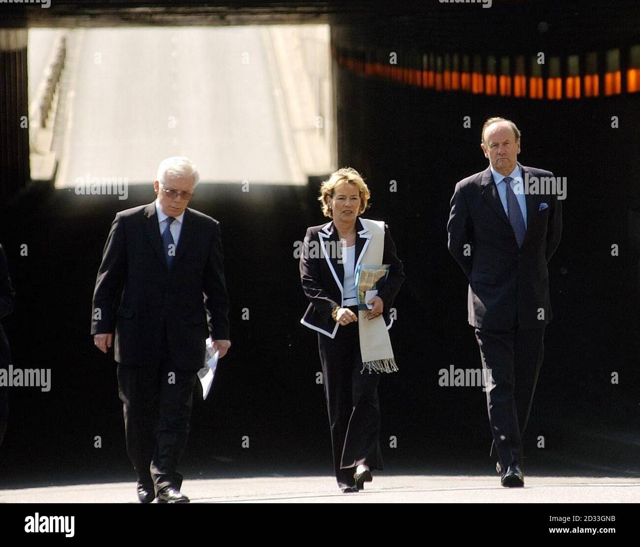 (from left-right) Royal Corroner Michael Burgess with French police chief Madame Martine Monteil and Metropolitan Police Commissioner Sir John Stevens walking through the road tunnel near Pont de l'Alma, in which Diana, the Princess of Wales, and Dodi Fayed died in a car crash seven years ago. Sir John said so far he had only been looking at general information such as videos and photographs. Stock Photo