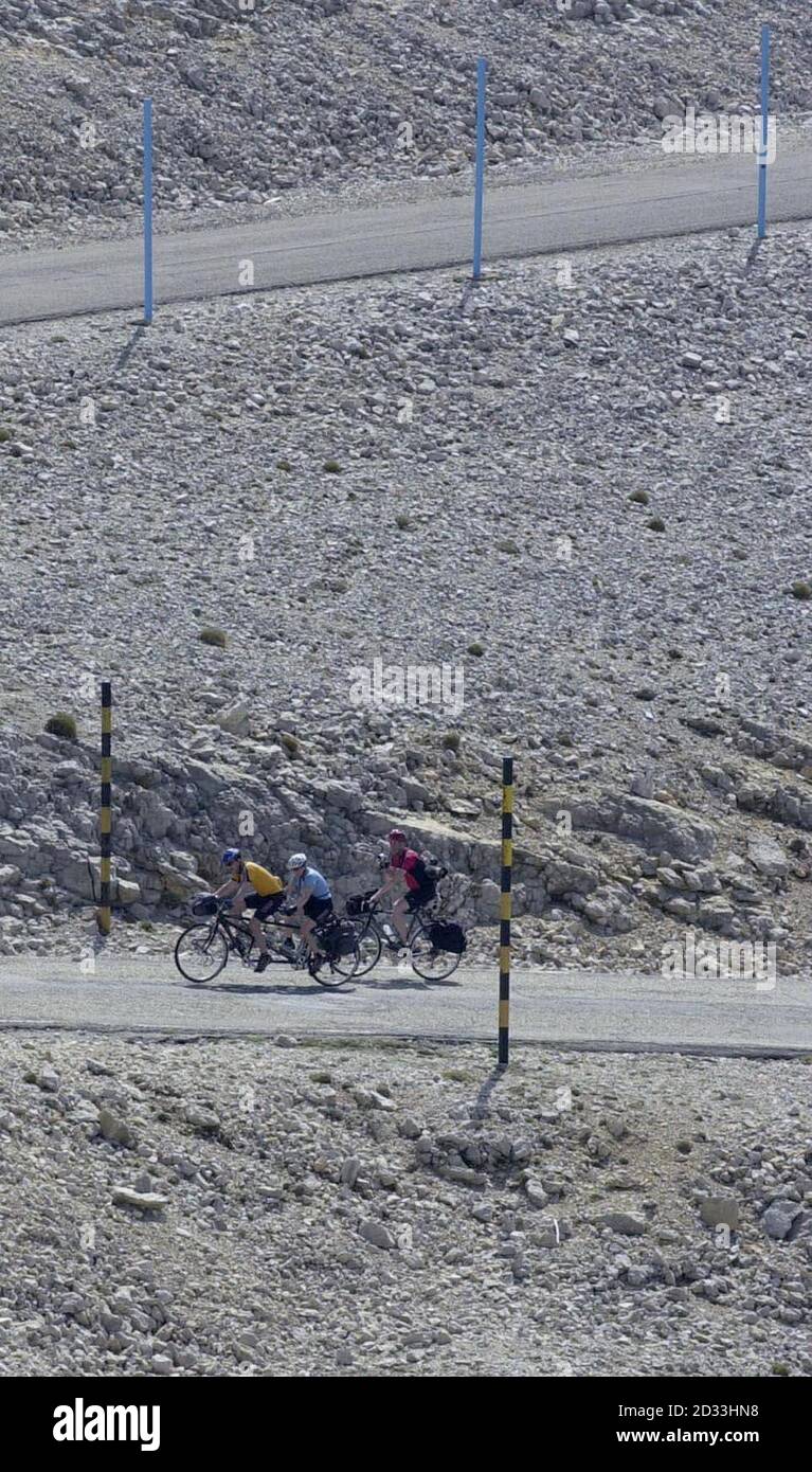 Jane Tomlinson and her brother Luke Goward, both from Leeds in West Yorkshire, are filmed as they ride tandem on the ascent of Mont Ventoux in Provence, within the south-east of France - the most feared climb in the Tour de France - as they continue their tandem ride which began in Rome more than two weeks ago and which they hope will take them to the finish in Leeds. Jane was diagnosed terminally ill with cancer in her bones four years ago and was given six months to live by doctors. She has since ran three London marathons, completed an 'Iron Man' event and cycled from John O'Groats to Land' Stock Photo