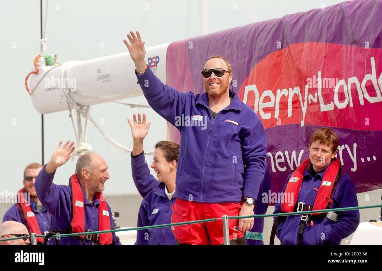 Skipper Sean McCarter waves as Derry-Londonderry-Doire arrives in San Francisco after racing from China in the Clipper Round the World Yacht Race on Friday, April 11, 2014. British sailor Andrew Taylor, a crewmember who fell overboard during rough weather in Race 10 Leg 6, was taken to a hospital after docking. Stock Photo