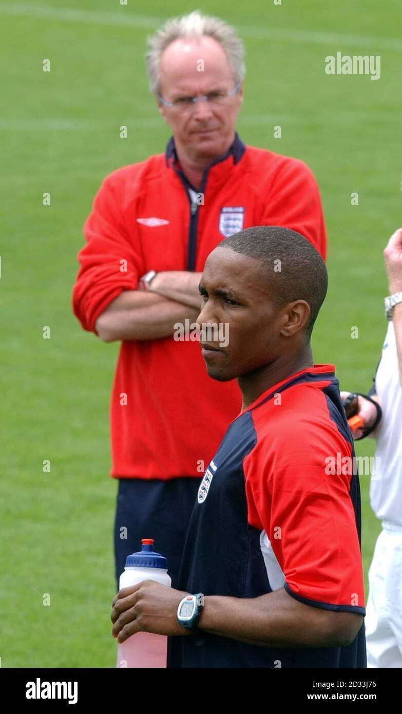 England manager Sven Goran Eriksson overlooks Jermain Defoe (front) during a training session at the Forte Village Hotel complex in Sardinia. England are in Sardinia for preperation ahead of Euro 2004. Stock Photo