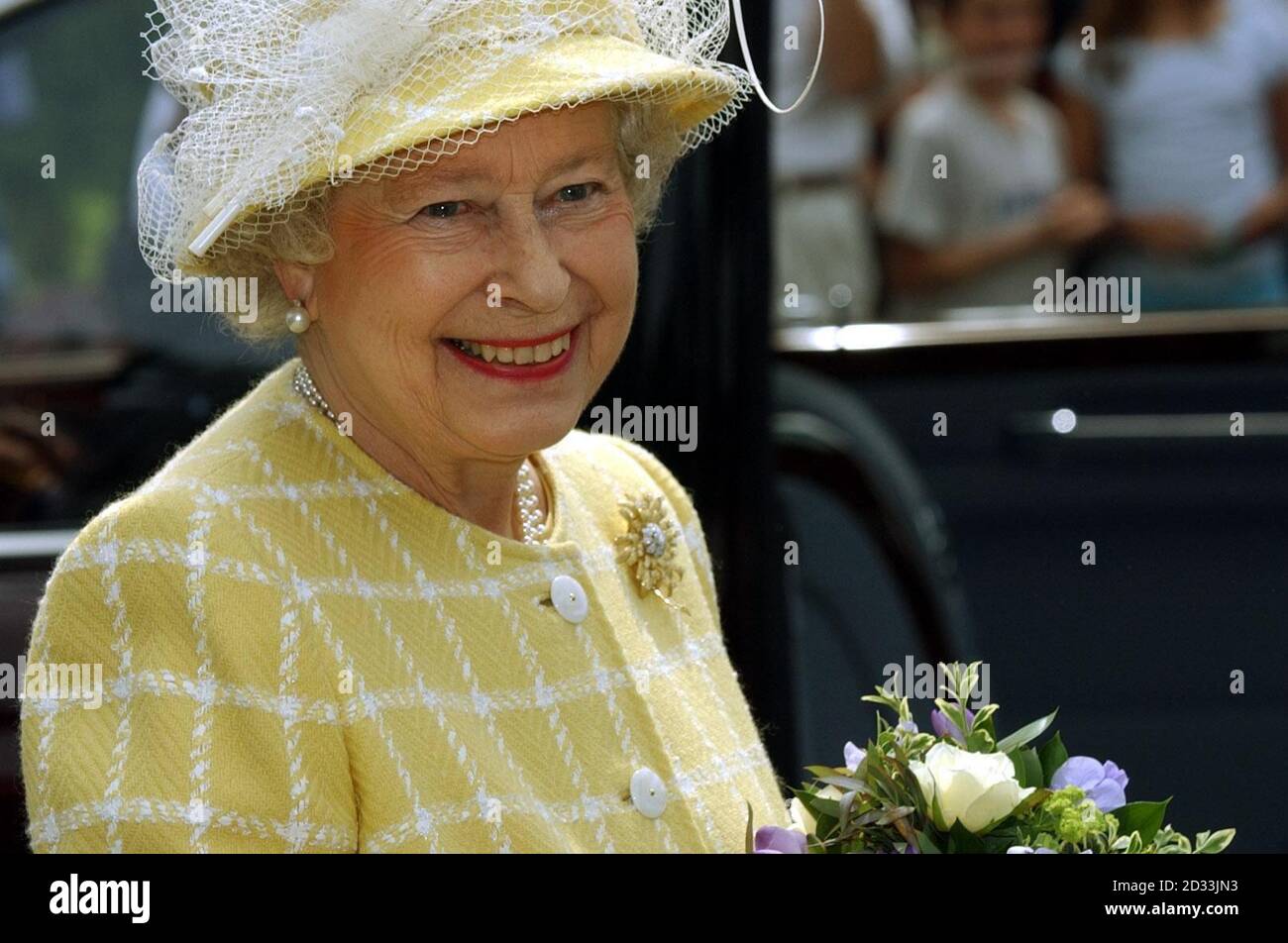 Queen Elizabeth II during a tour of the Royal Botanical Gardens in Kew, London. The Queen visited the gardens today to unveil a plaque commemorating the attraction's status as a World Heritage Site. Stock Photo