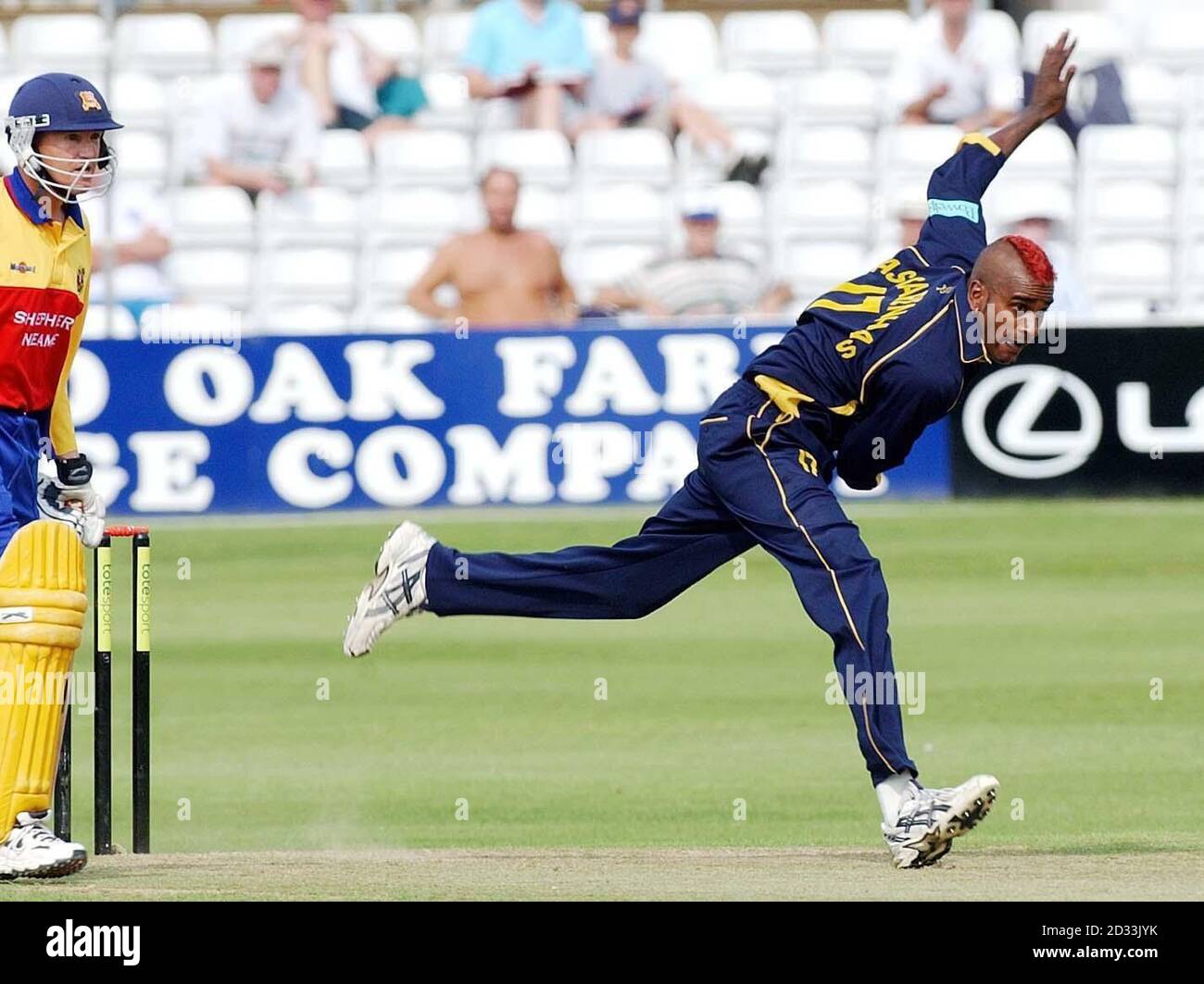 Hampshire Hawks bowler Dimitri Mascarenhas in action with a Mohican hair cut, during their tote Sport League Division One match against Essex Eagles at Chelmsford, Essex. Stock Photo
