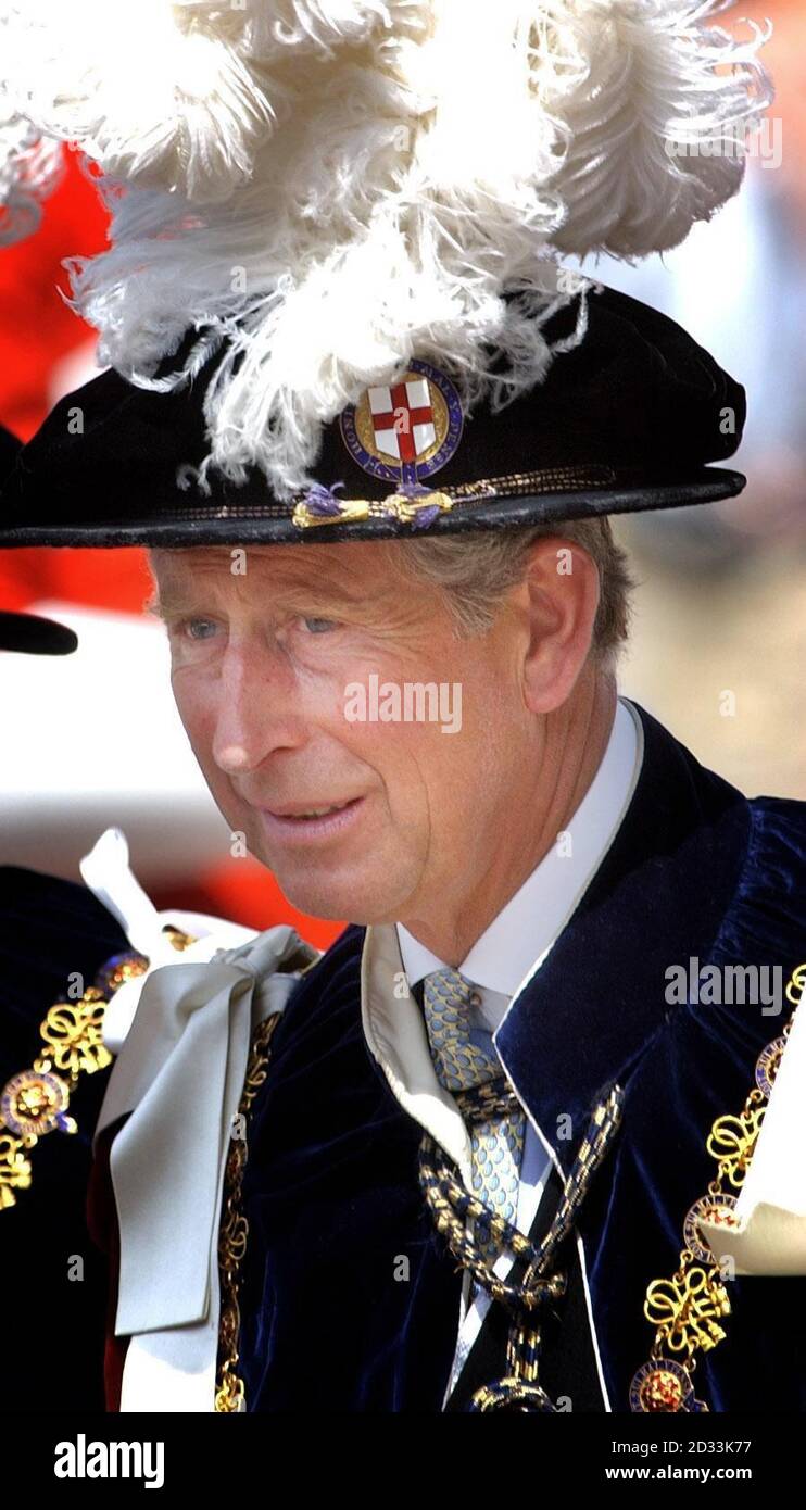 The Prince of Wales at Windsor Castle in Berkshire, where he was taking part in the annual ceremony of the Order of the Garter. Each year, the Knight Companions, and Royal Knights and Ladies of the Order of the Garter make the traditional walk down the hill to St George's Chapel from the State Apartments. Founded in 1348 by Edward III, the Garter is awarded by the sovereign for outstanding public service and achievement. Stock Photo