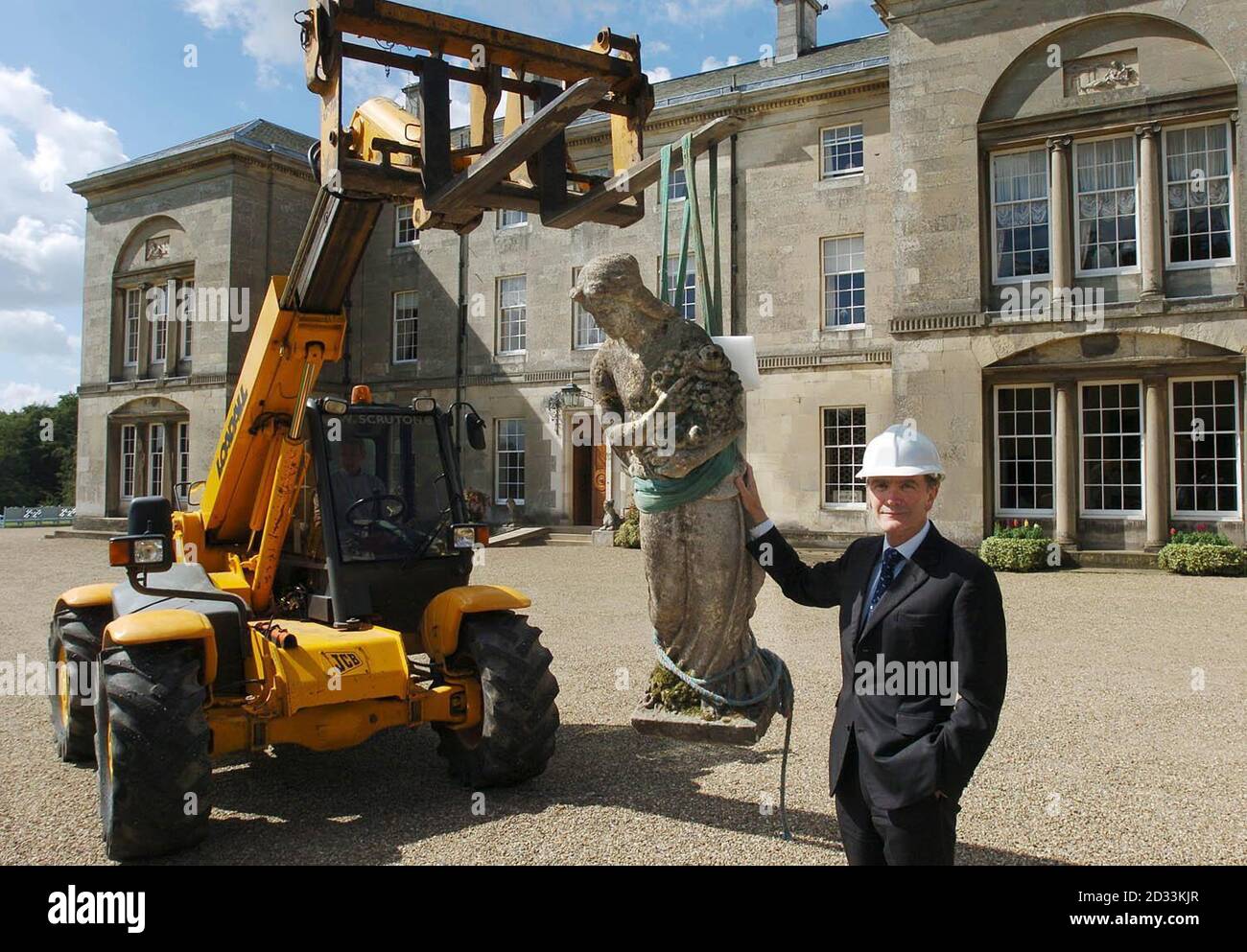 A half-ton statue which was stolen from a stately home in Yorkshire and later recovered 4,000 miles away in Chicago was today being restored to its rightful plinth.  The returned statue arrives at Sledmere House, of a Greek Goddess with Sir Tatton Sykes, following the discovery of the half ton statue in Chicago by antique recovery detectives was today being returned to its place in the gardens of the Stately Home. Stock Photo