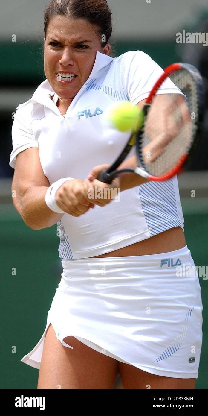 Jennifer Capriati from the USA in action against Nadia Petrova from Russia in the fourth round of the Ladies Single tournament of The Lawn Tennis Championships at Wimbledon, London. Stock Photo