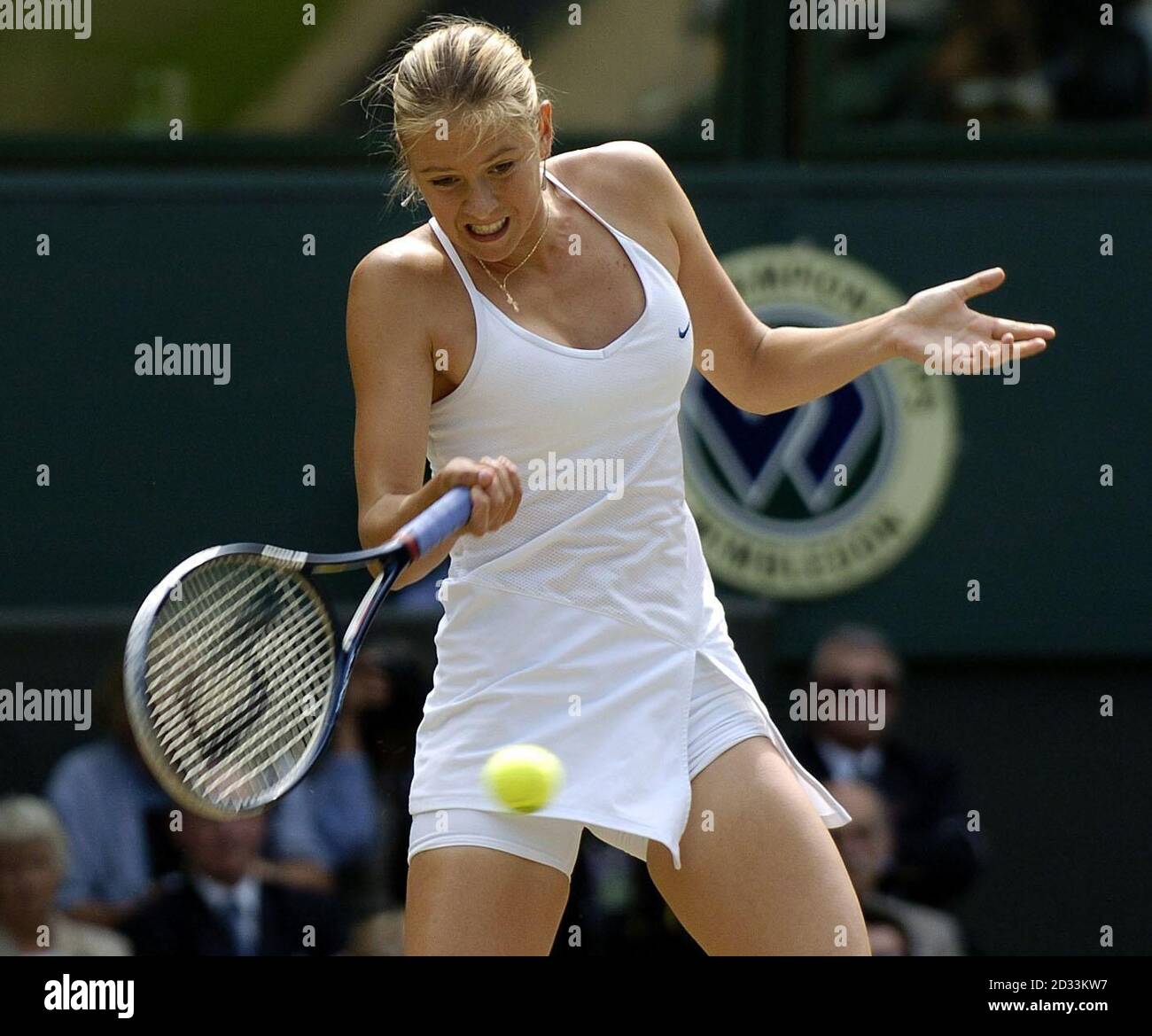 Maria Sharapova from Russia in action against Serena Williams from the USA in the final of the Ladies' Singles tournament at The Lawn Tennis Championships at Wimbledon, London.  EDITORIAL USE ONLY, NO MOBILE PHONE USE. Stock Photo
