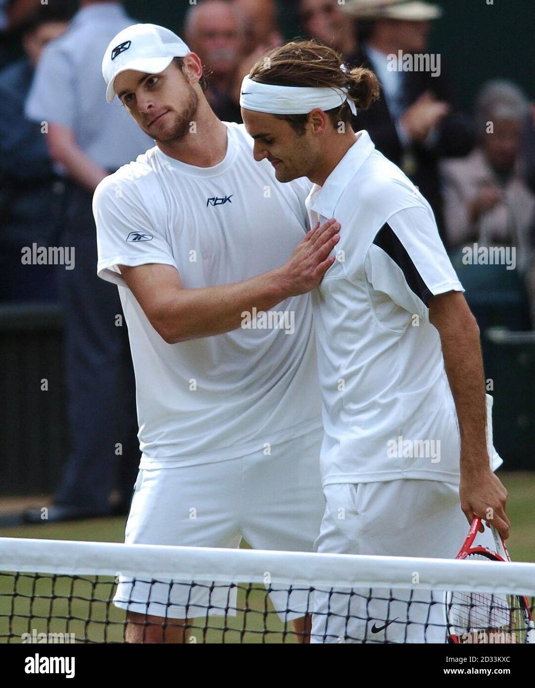 Roger Federer from Switzerland and Andy Roddick from the USA embrace after  the final of the Men's Singles tournament at The Lawn Tennis Championships  at Wimbledon, London. Final score 4:6/7:5/7:6/6:4 to Federer.
