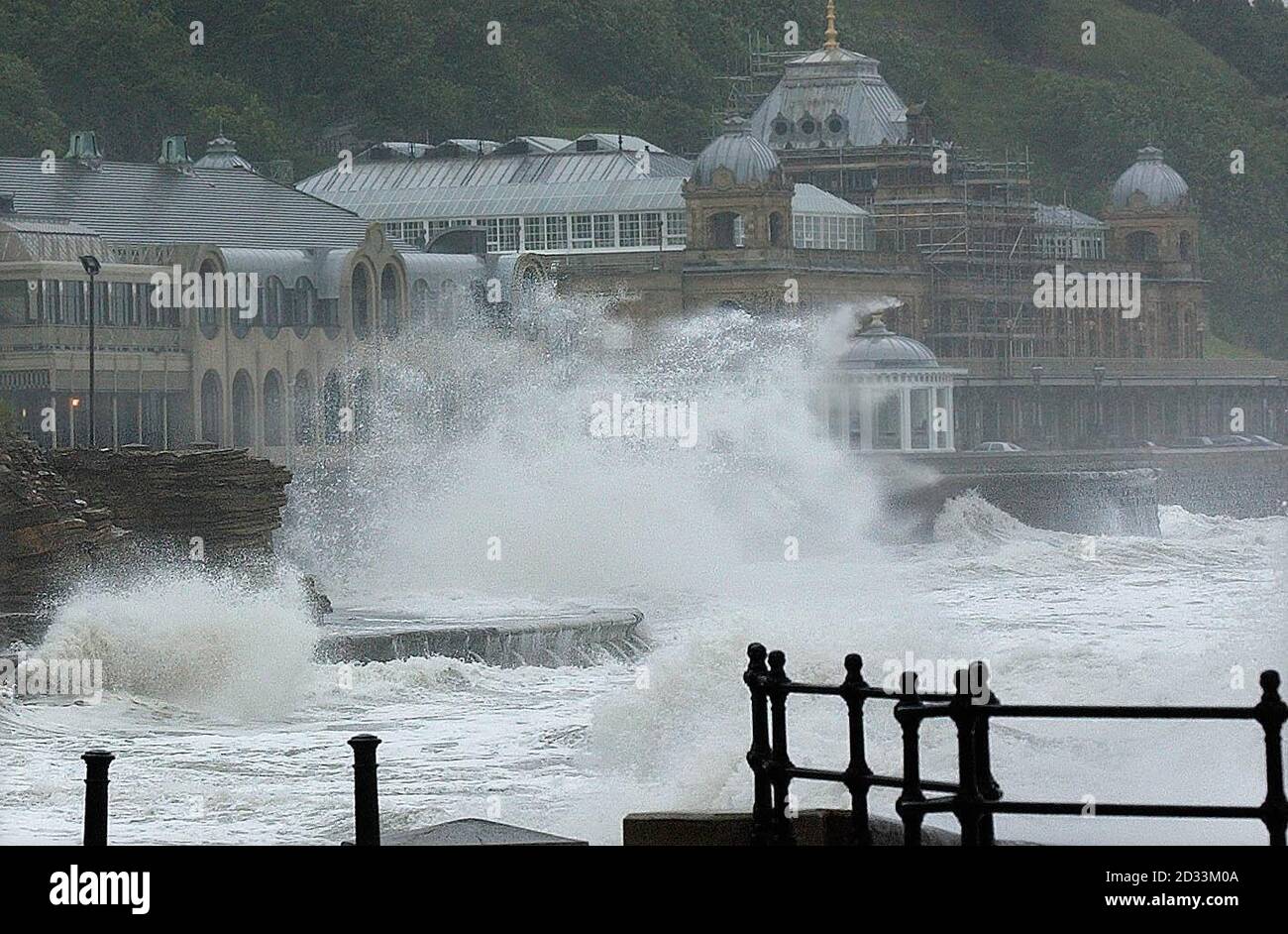 Gale force winds, high tides and torrential rain pound the Spa Theatre, at Scarborough. As the UK recovers from some of the worst summer storms on record, thousands of homes were still without electricity. Stock Photo