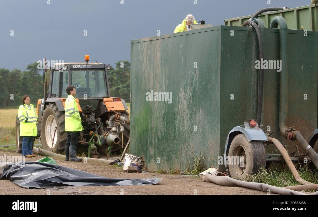 Members of the Health and Safety Executive inspect the site of the