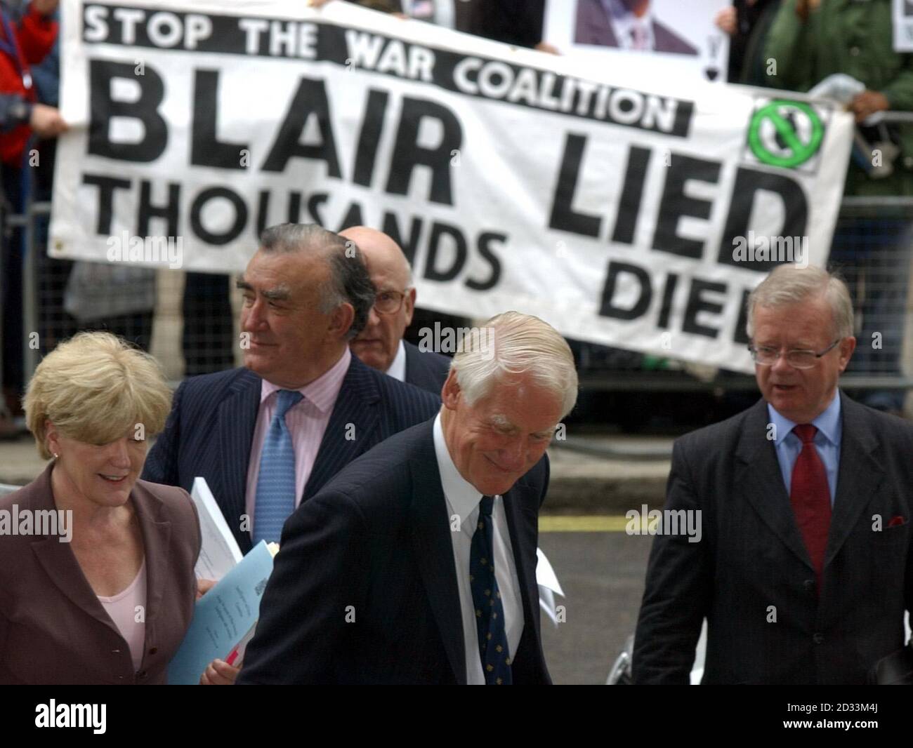 Lord Butler (centre) and his team, from left, Ann Taylor, Michael Mates, Lord Inge and Sir John Chilcott arrive for a news conference in Westminster, central London, following the publication of his report into intelligence failings in the run-up to war in Iraq. He was commissioned in February to look into the gap between the intelligence community's pre-war claims that Iraqi dictator Saddam Hussein had illicit arsenals of weapons of mass destruction and the failure of the Iraq Survey Group to find any trace of such stockpiles. Stock Photo