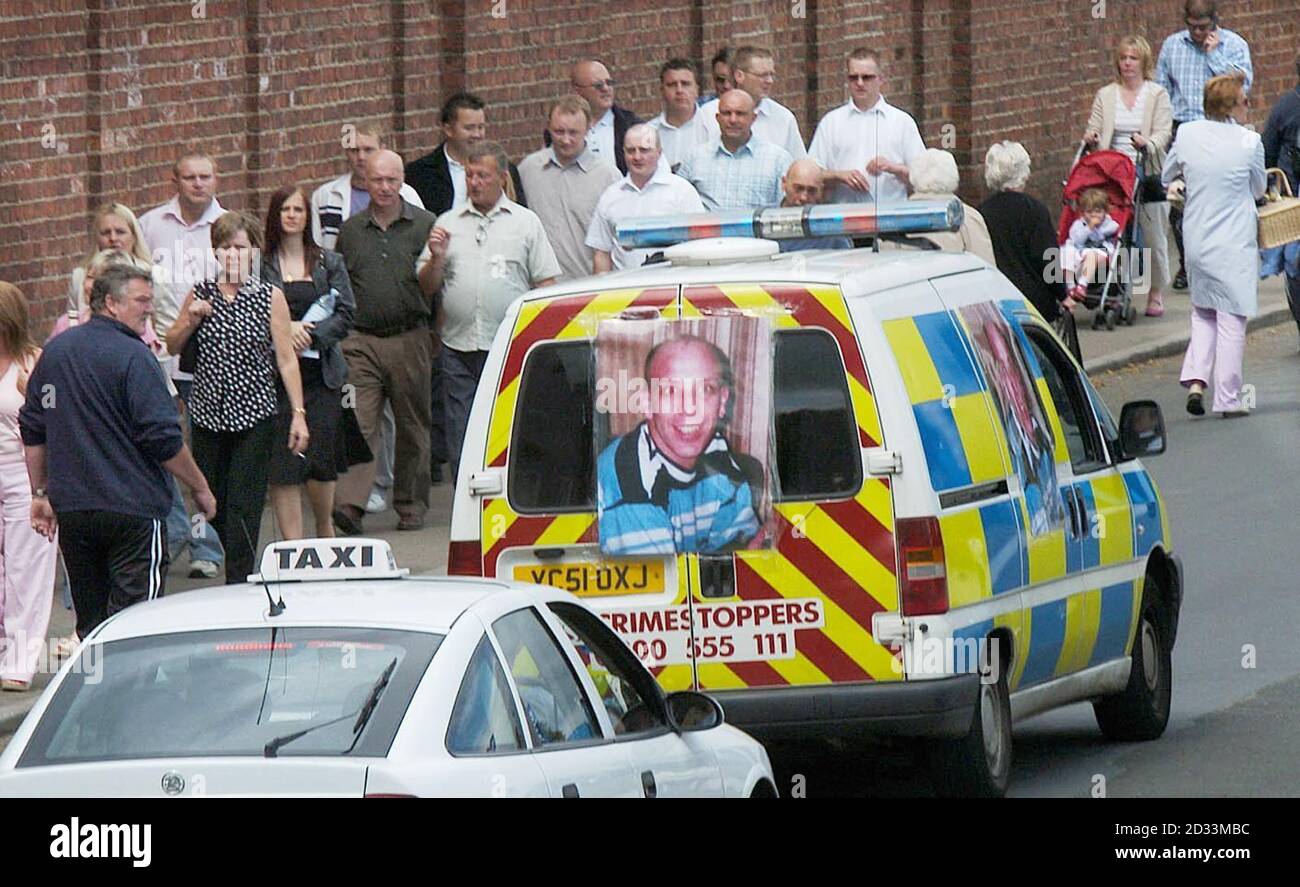 A Police van with posters of fugitive Mark Hobson drives around York, where Police investigating two double murders are distributing 10,000 leaflets containing details of the chief suspect to race-goers. Stock Photo