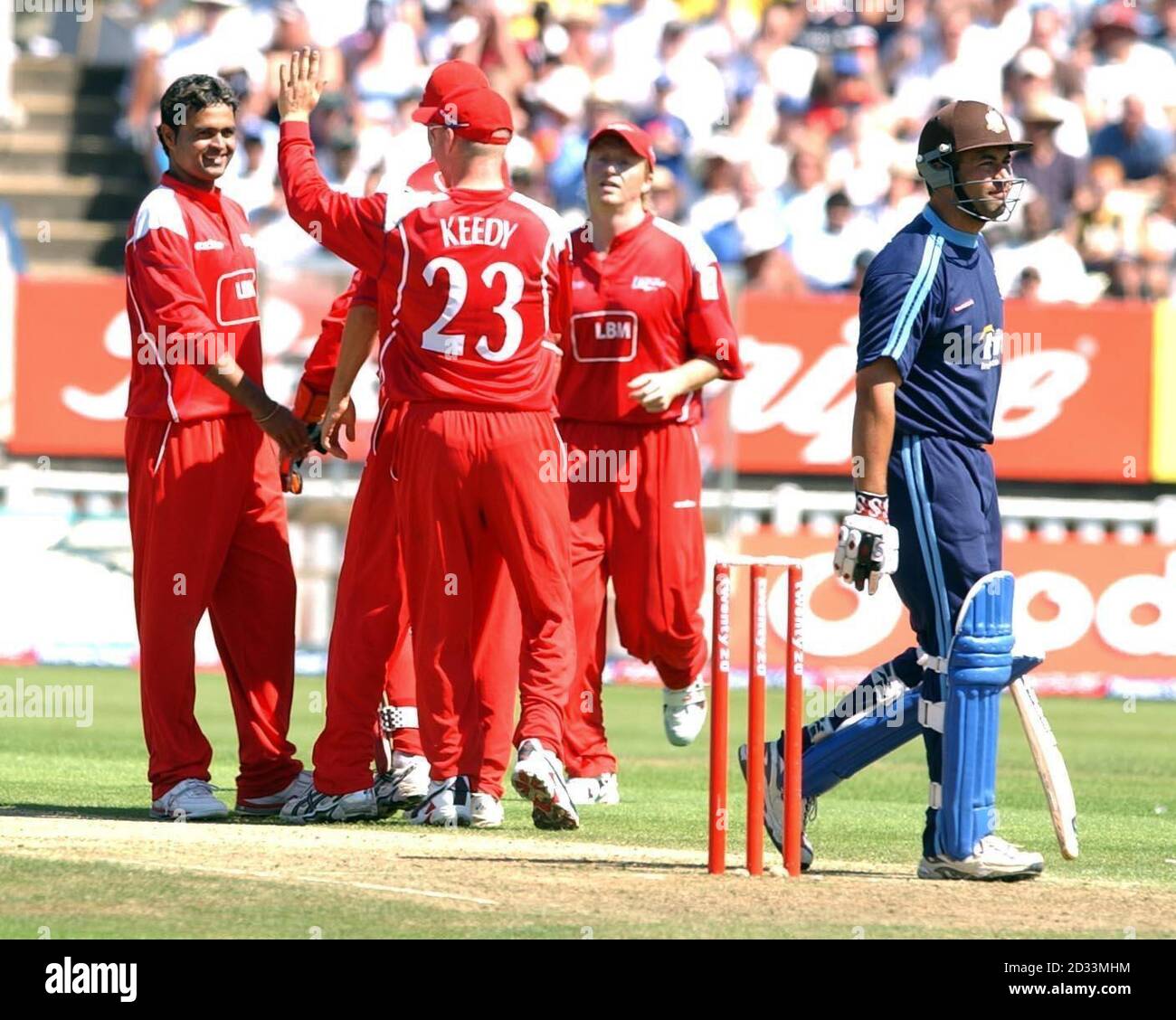 Lancashire Lightning players celebrate after Surrey Lion's Adam Hollioake was caught by Warren Hegg off the bowling of Mongia for 1 run during their Twenty20 Cup semi-final at Edgbaston. Stock Photo