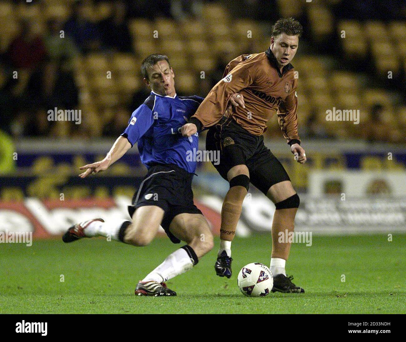 Wolverhampton Wanderers' Adam Proudlock (right) is tackled by Crewe's Dave Walton during the Nationwide Division One game between Wolverhampton Wanderers and Crewe Alexandra at Molineux Stadium, Wolverhampton. THIS PICTURE CAN ONLY BE USED WITHIN THE CONTEXT OF AN EDITORIAL FEATURE. NO UNOFFICIAL CLUB WEBSITE USE. Stock Photo