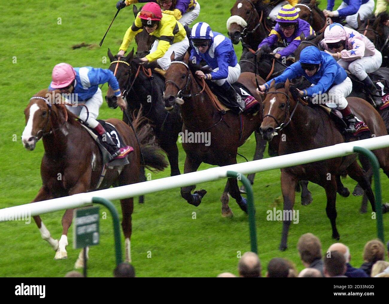 Munir (front) ridden by Darryll Holland wins the Victor Chandler Challenge Stakes at Newmarket races. Stock Photo