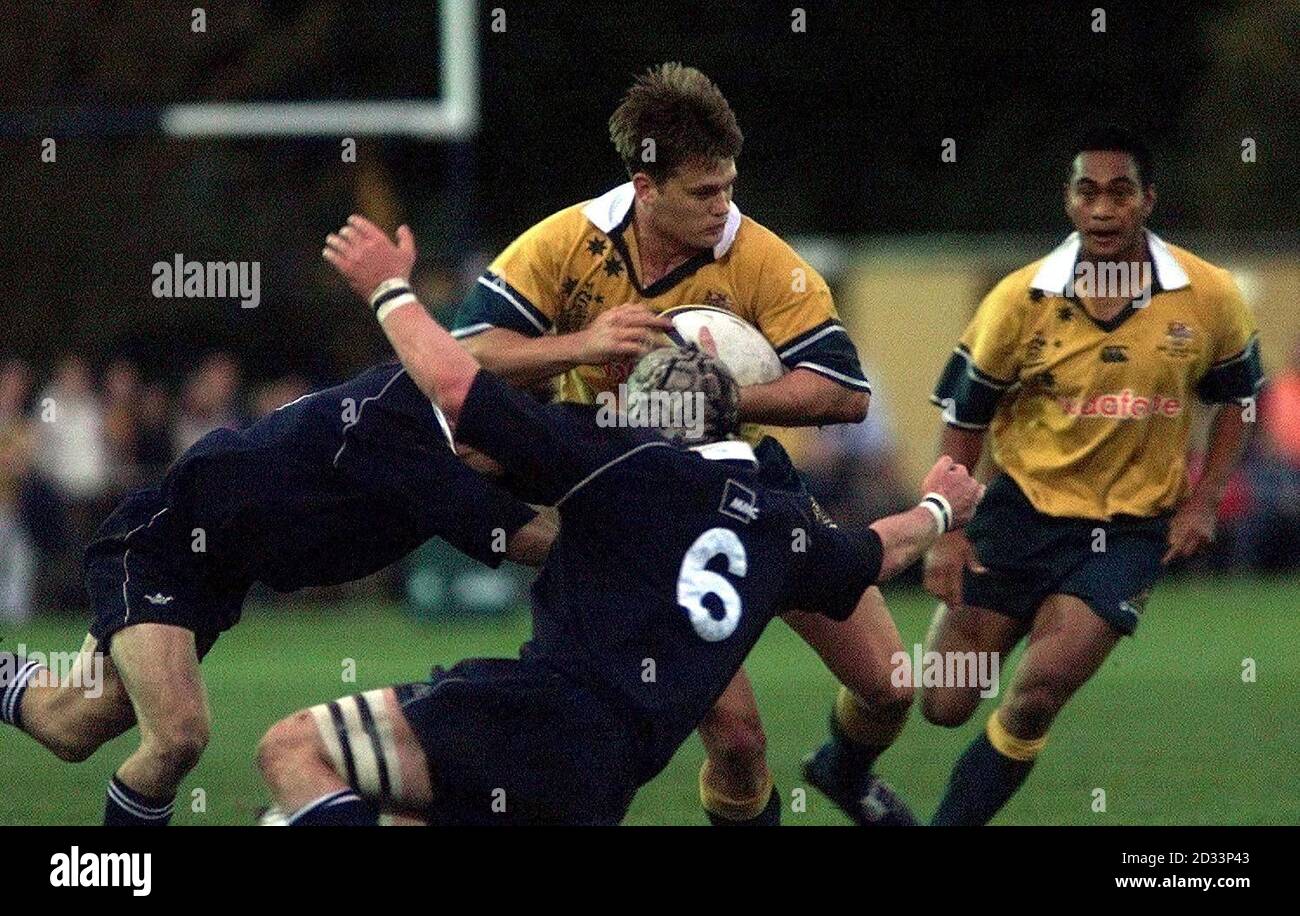 Australia's Ben Tune (centre) bursts through the tackle of Luke Sherriff of Oxford during the Tour match between Oxford University and Australia at Iffley Road, Oxford. Stock Photo