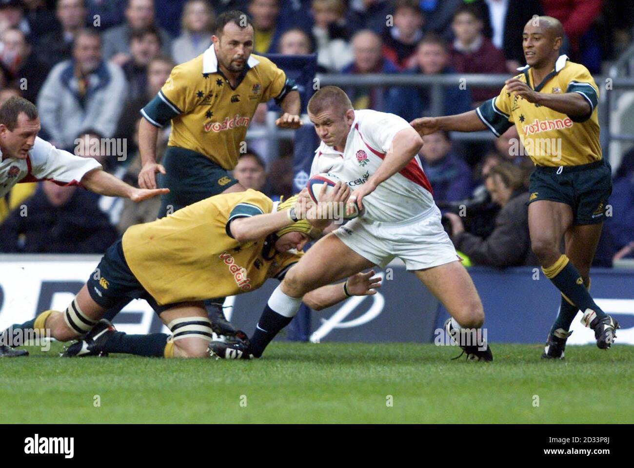England's Graham Rowntree (centre) is challenged by Australia's Justin ...