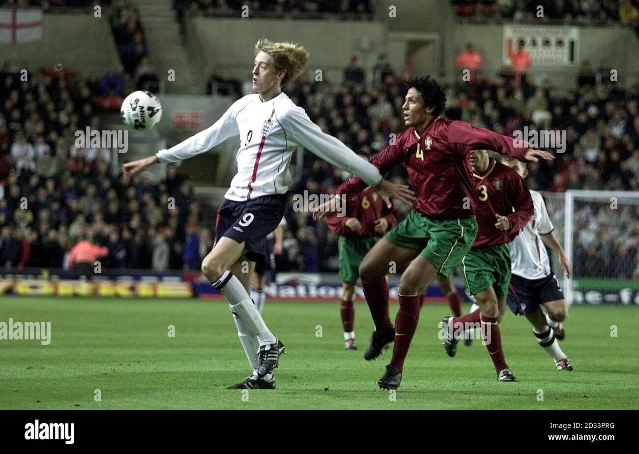 England's Peter Crouch (left) in action against Portugal's Bruno during the  Under-20's International between England and Portugal at St Mary's,  Southampton. THIS PICTURE CAN ONLY BE USED WITHIN THE CONTEXT OF AN