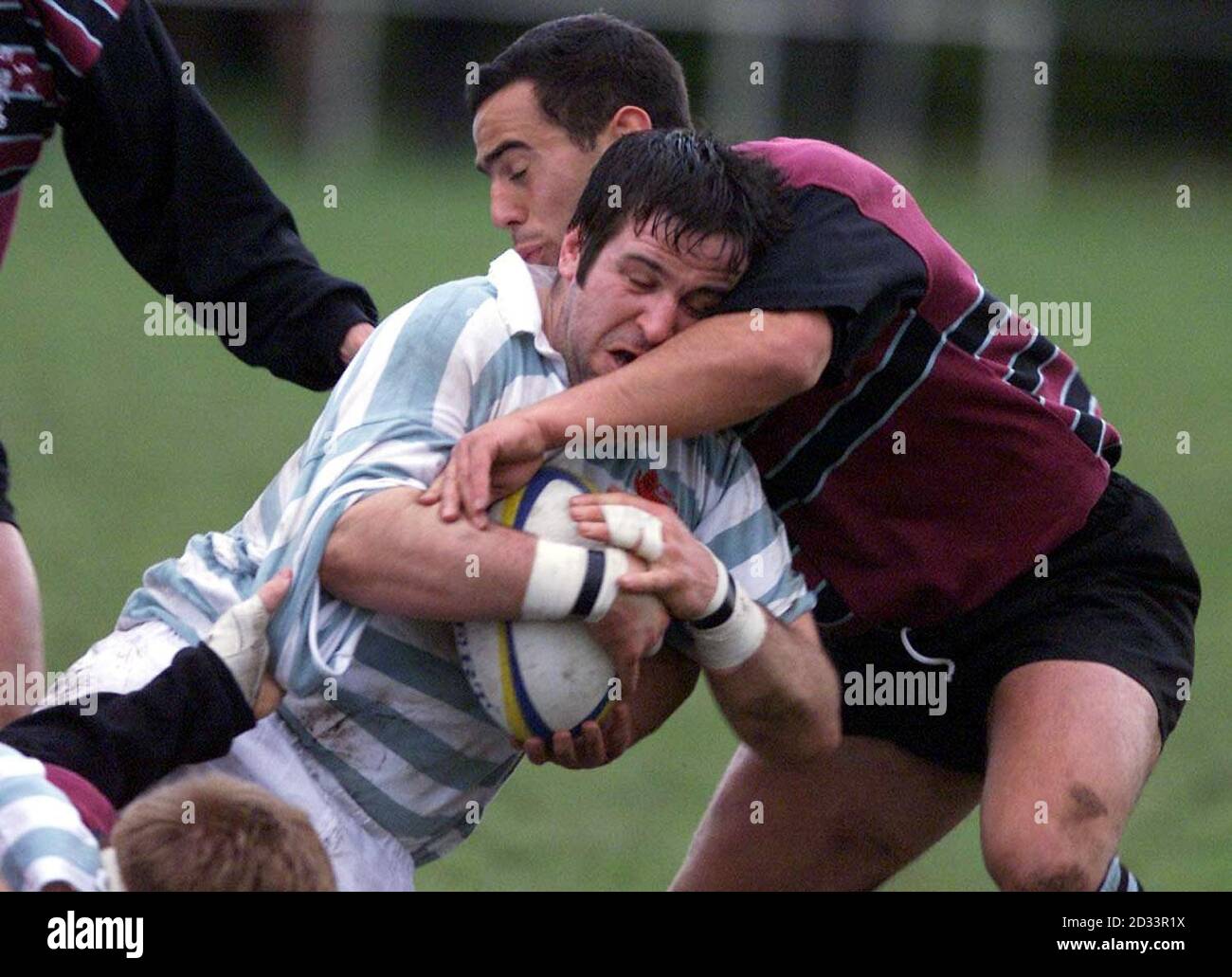 Cambridge University's Des Brett is challenged by Steele-Bodger's Jason Wright (right) during the 54th annual game between Cambridge University and Steele-Bodger at Grange Rd ,Cambridge. * The Steele-Bodger side consists of professional Rugby Union players and competes with the Cambridge University team on an annual basis. Stock Photo