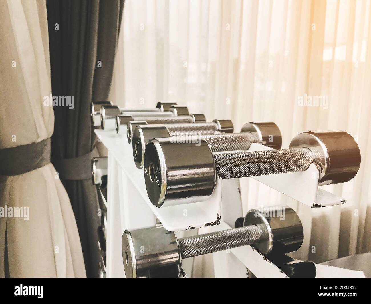 Closeup group of dumbbells different weights for exercising arm muscles