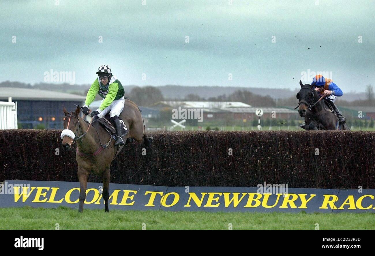Valley Henry with jockey Timmy Murphy (left) wins ahead of Frosty Canyon with jockey Dean Gallagher in the Telebet Novices Chase at Newbury. Stock Photo