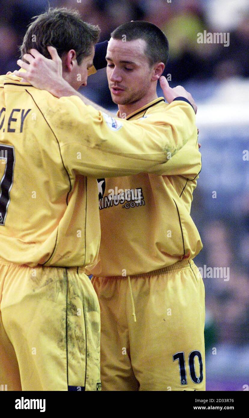 Wimbledon's David Connolly (right) celebrates after a first-half free kick puts his team 2-0 up against Stockport County in their Nationwide League Division One match at Edgeley Park, Stockport. A late first-half goal from Stockport later put the half-time score at 2-1. THIS PICTURE CAN ONLY BE USED WITHIN THE CONTEXT OF AN EDITORIAL FEATURE. NO UNOFFICIAL CLUB WEBSITE USE. Stock Photo