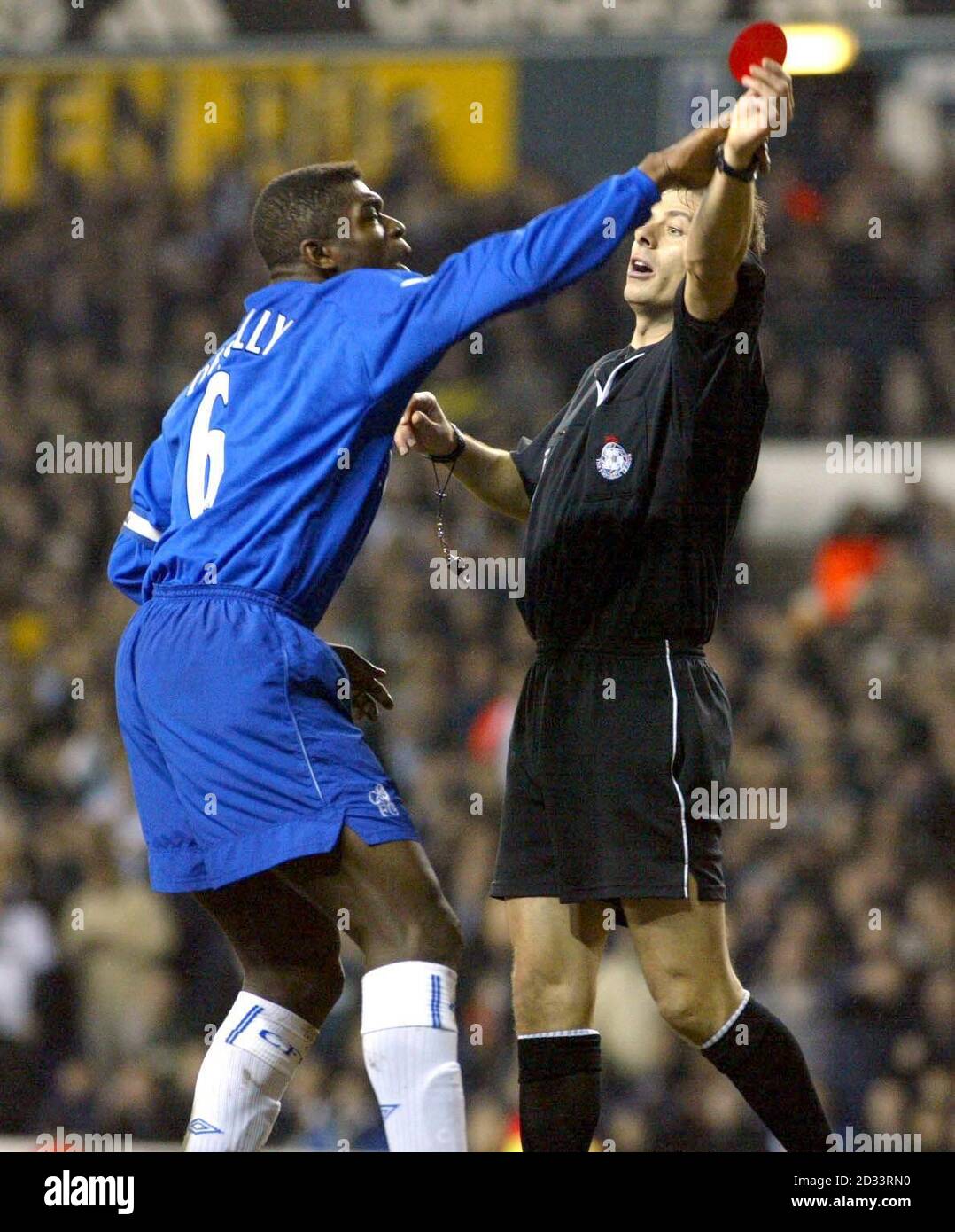 Chelsea's skipper Marcel Desailly tries to stop match referee Mark Halsey raiseing the red card to dismiss Jimmy Floyd Hasselbaink. After 55 minutes, Hasselbaink fouled Sullivan and that sparked a melee inside the Spurs box.   *  Referee Mark Halsey brandished the red card at the big striker for pushing Sheringham in the face  but he got the wrong Dutchman as Mario Melchiot was the real offender. during their Worthington Cup semi-final, 2nd leg match Spurs at Tottenham's, White Hart Lane ground.  THIS PICTURE CAN ONLY BE USED WITHIN THE CONTEXT OF AN EDITORIAL FEATURE. NO WEBSITE/INTERNET USE  Stock Photo