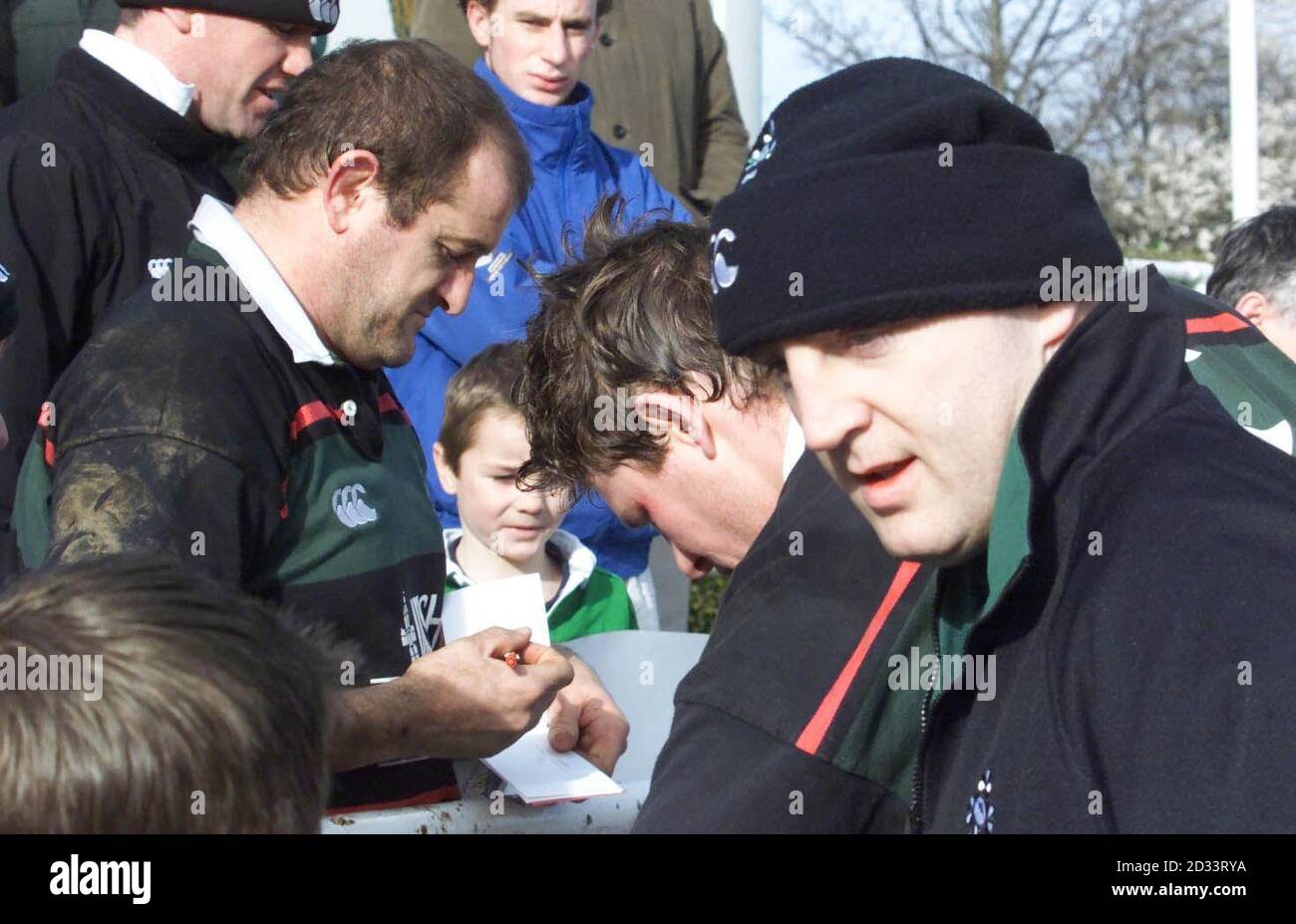Ireland's Captain Keith Wood (right) out of the team because of a leg injury, signs autographs for fans with prop Peter Clohessy, after a training session at Greystones Co. Wicklow, Eire, before Saturday's Lloyds TSB Six Nations Championship match match against England. Stock Photo