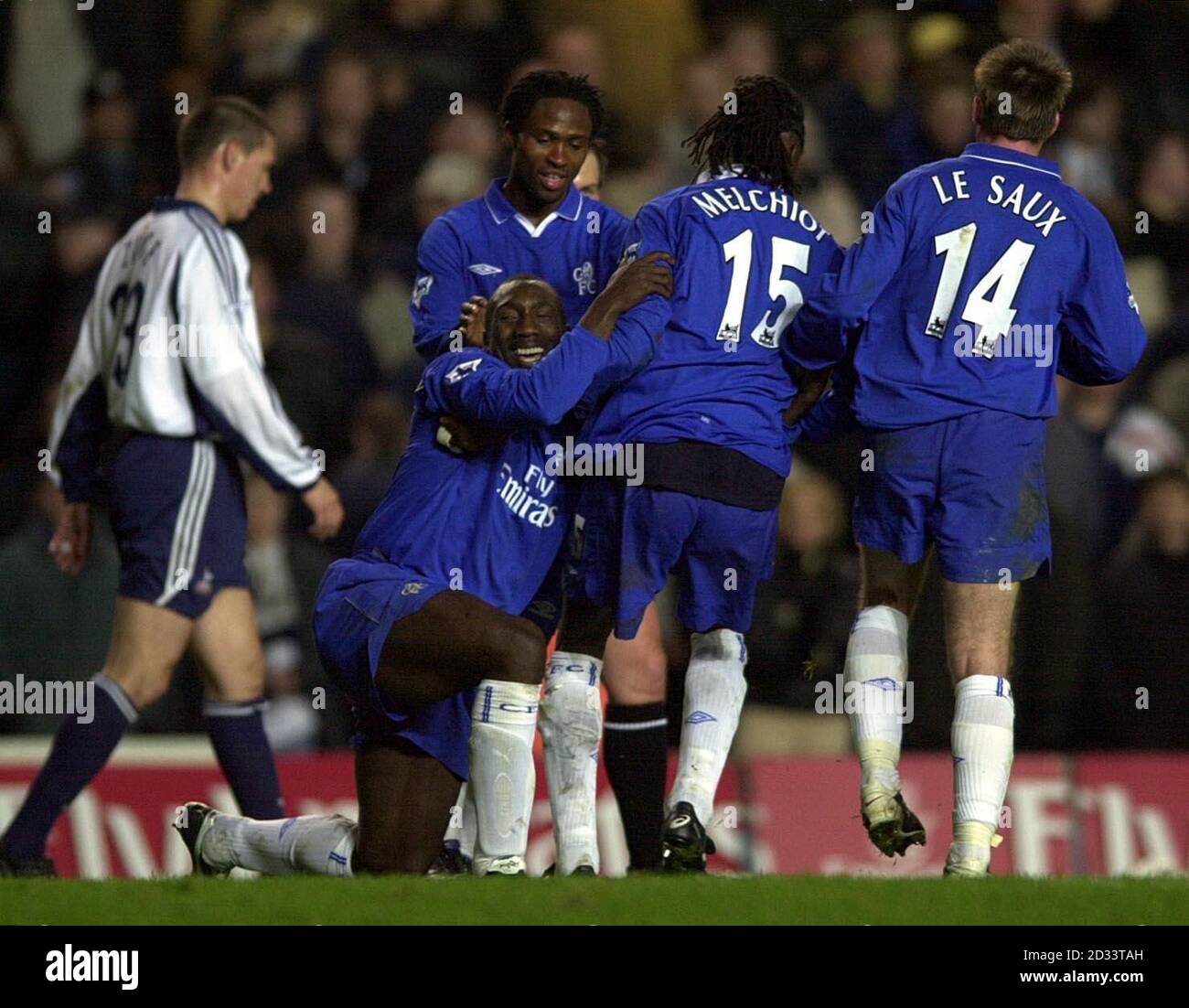 Chelsea's Jimmy Floyd Hasselbaink is helped to his feet after scoring his hat-trick goal against Tottenham Hotspur, during their FA Barclaycard Premiership match at Stamford Bridge. Stock Photo