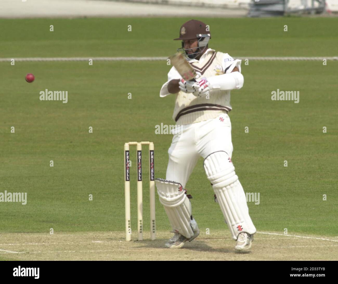Nadeem Shahid drives a ball from Sussex bowler R Martin Jenkins to the boundary for four. Nadeem hit a career best 150 for Surrey on the second morning of their season-opening Frizzell County Championship match at the Oval. Stock Photo