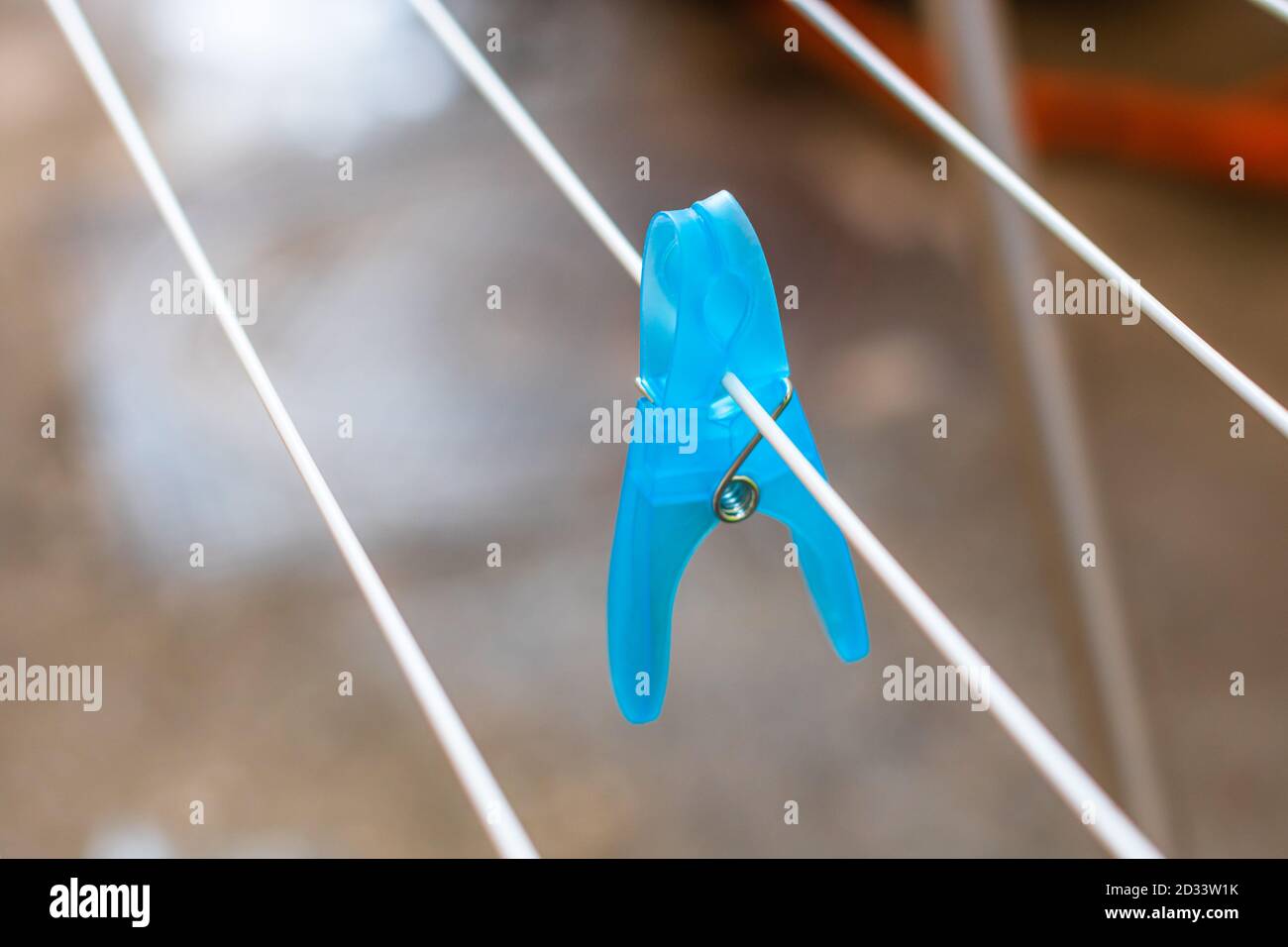 Colorful plastic clothes peg on empty metal clothes dryer Stock Photo Alamy