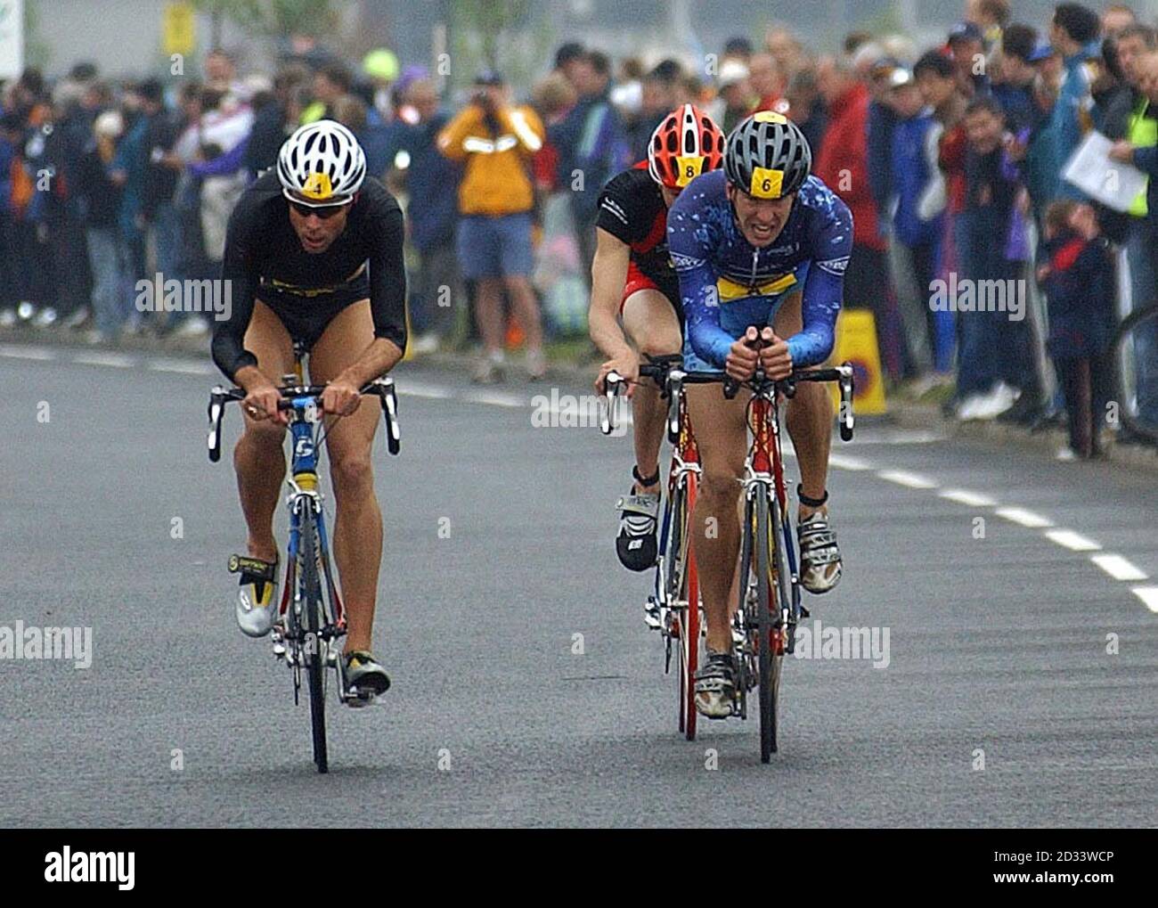 Simon Lessing (left) races alongside Richard Stannard (far right) before going onto win the British Triathlon Championship on Teeside. Stock Photo