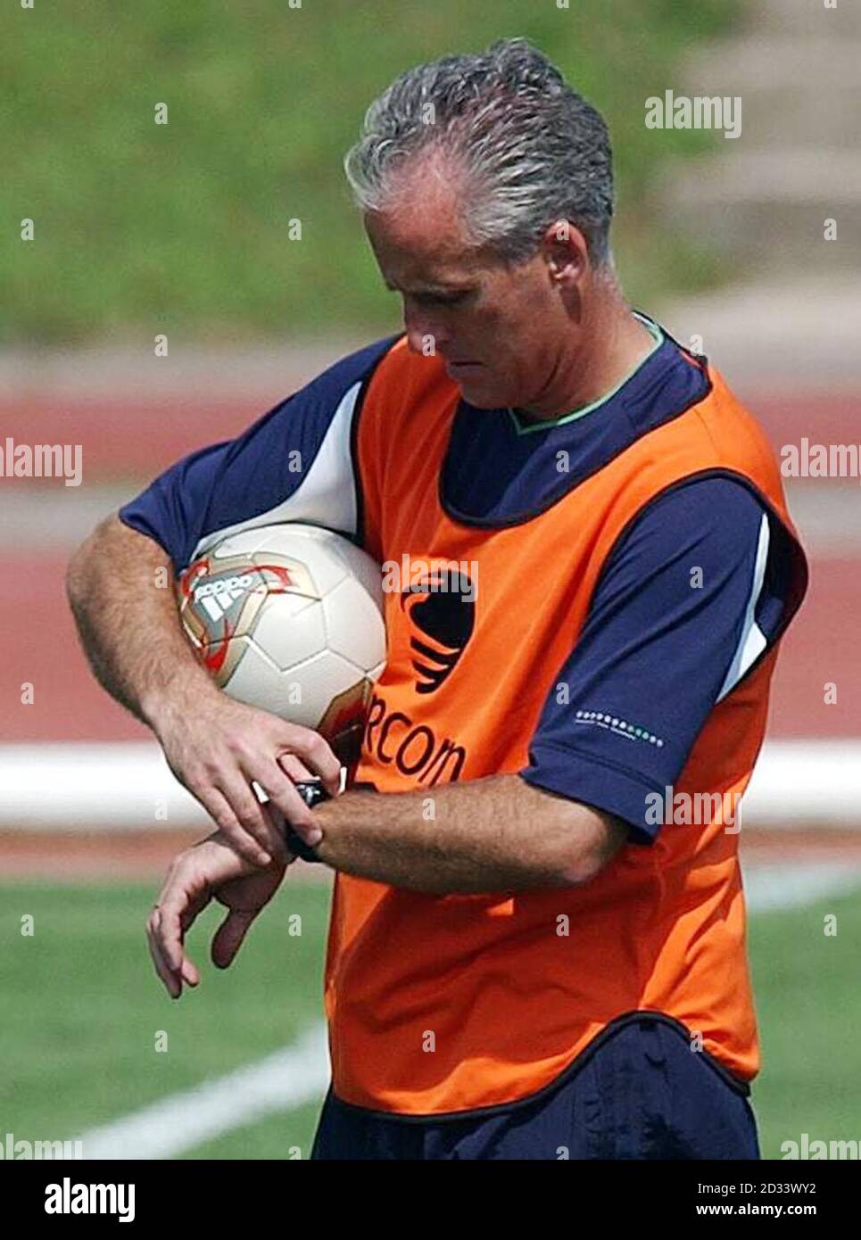 Republic of Ireland manager Mick McCarthy checks his watch during training at Sanggok-Dong Military Sports Facility, near Seoul, South Korea. Republic of Ireland play Spain in the World Cup, Second round match. Stock Photo